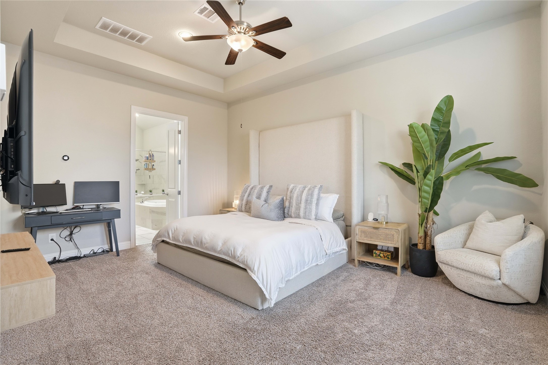 18606 Copano Lane Spring, TX 77379 - Photo 17 of 30 a spacious bedroom with a bed and a couch