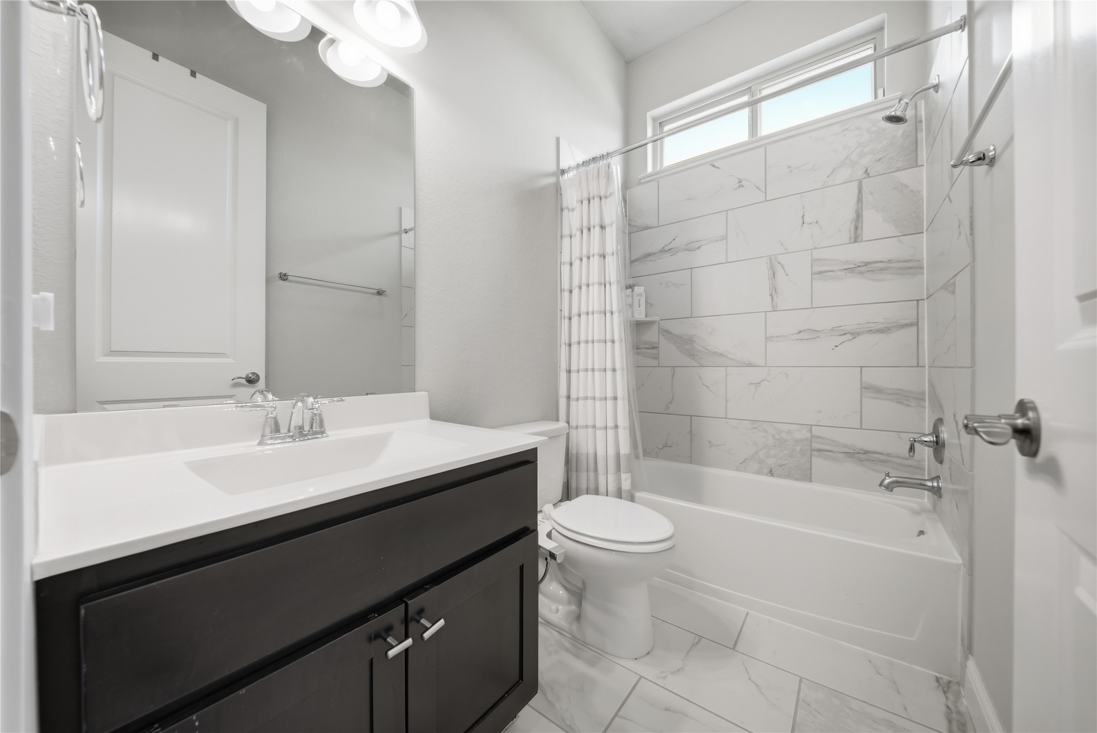 18606 Copano Lane Spring, TX 77379 - Photo 21 of 30 a bathroom with a sink a toilet and shower