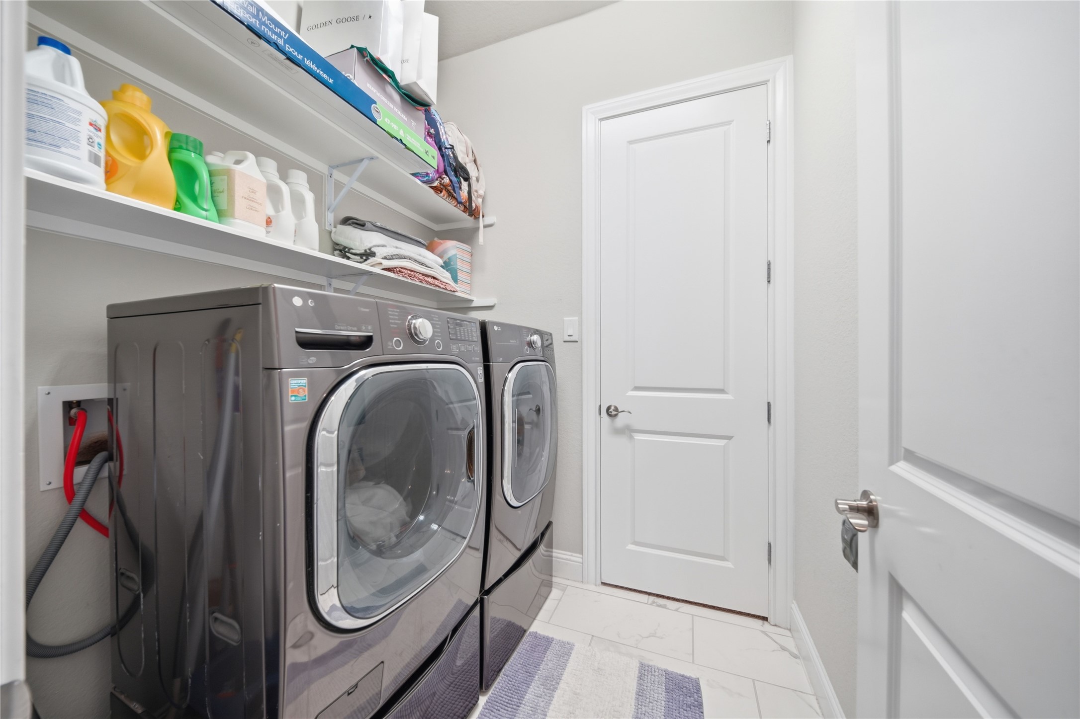 18606 Copano Lane Spring, TX 77379 - Photo 24 of 30 a view of a washer and dryer in a bathroom