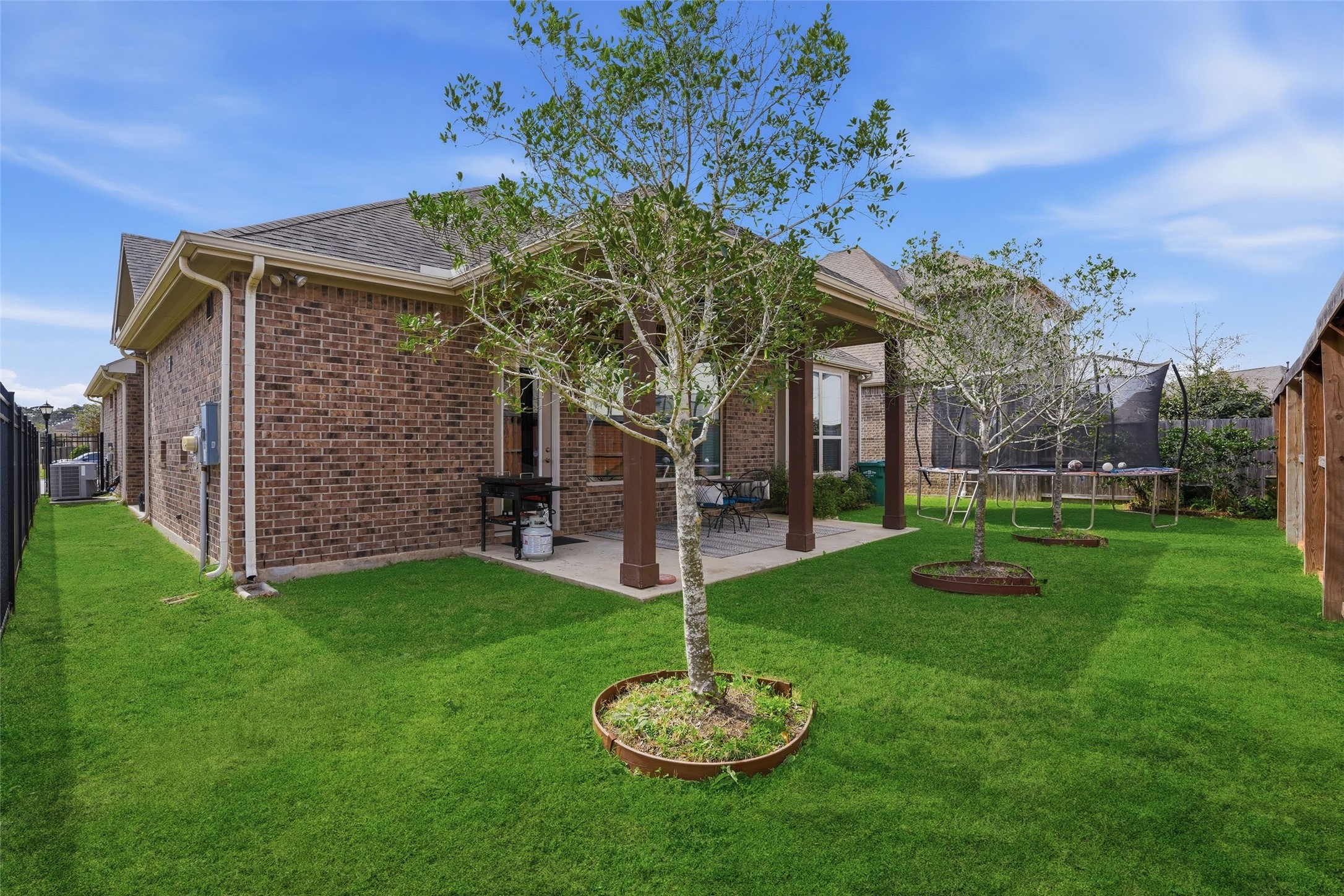 18606 Copano Lane Spring, TX 77379 - Photo 25 of 30 a house with garden in front of it