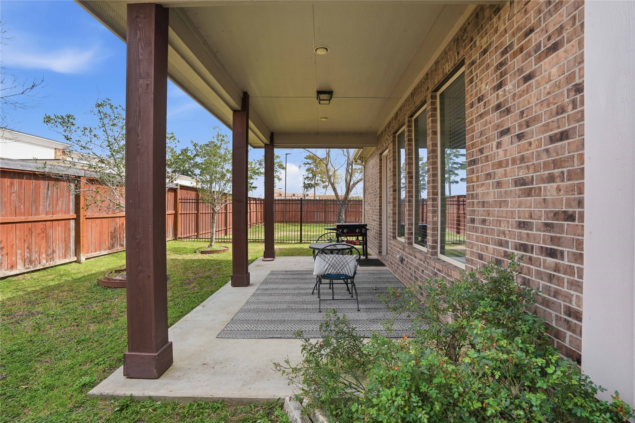 18606 Copano Lane Spring, TX 77379 - Photo 27 of 30 a view of a porch with chairs and backyard