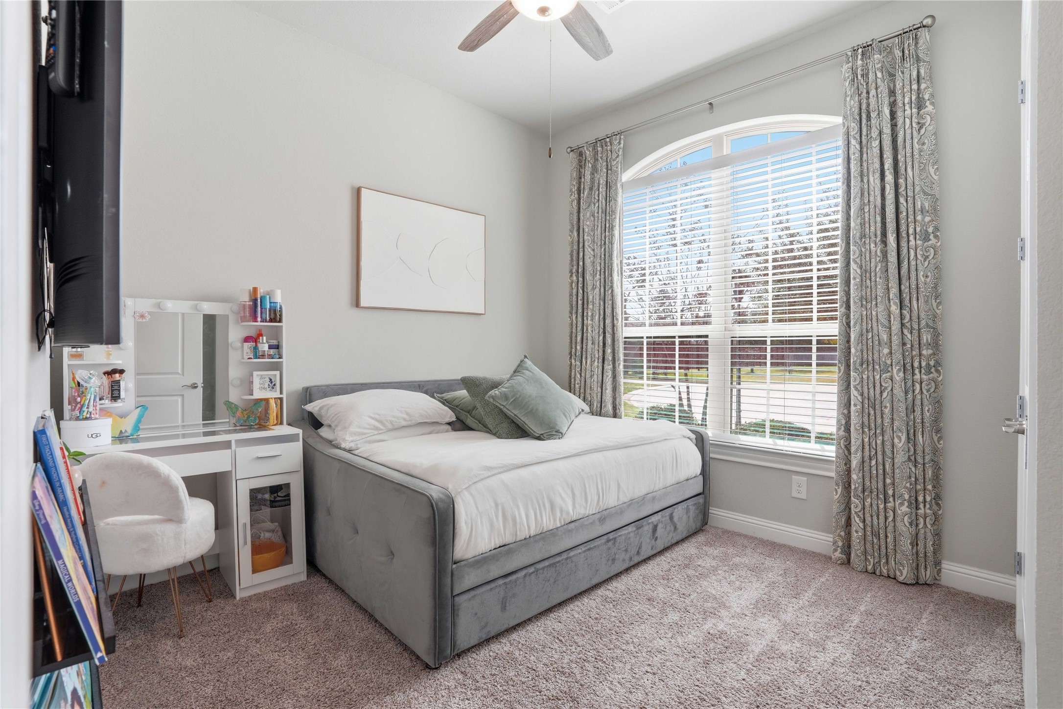 18606 Copano Lane Spring, TX 77379 - Photo 7 of 30 a bedroom with a bed and a chandelier