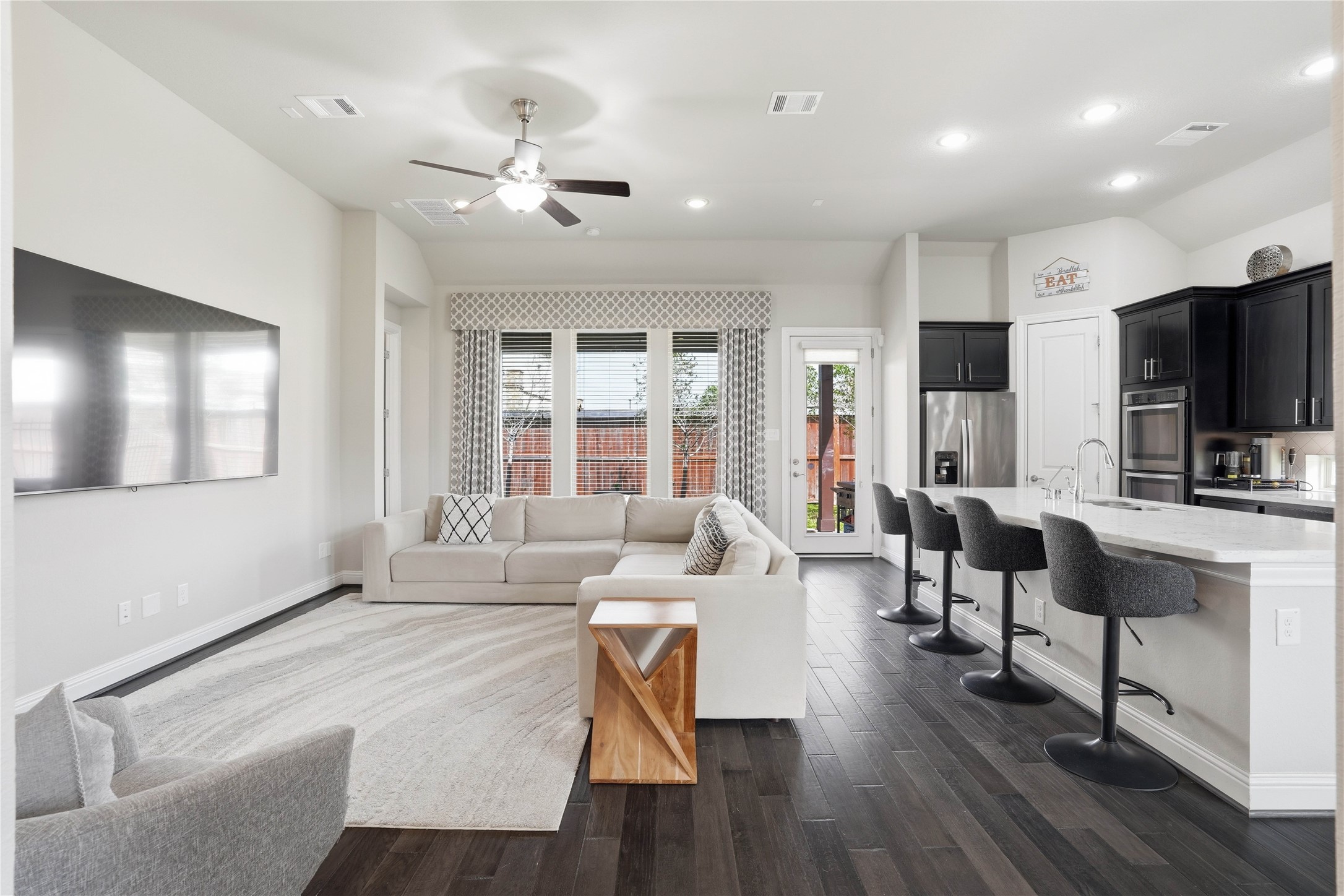 18606 Copano Lane Spring, TX 77379 - Photo 8 of 30 a living room with fireplace furniture and a flat screen tv