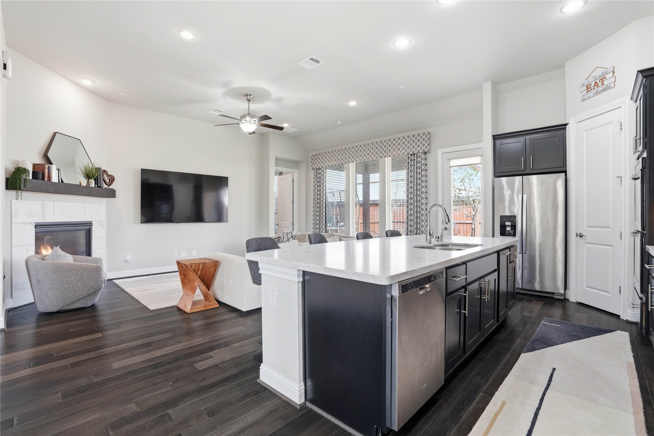 18606 Copano Lane Spring, TX 77379 - Photo 9 of 30 a large kitchen with stainless steel appliances granite countertop a lot of counter space and wooden floor