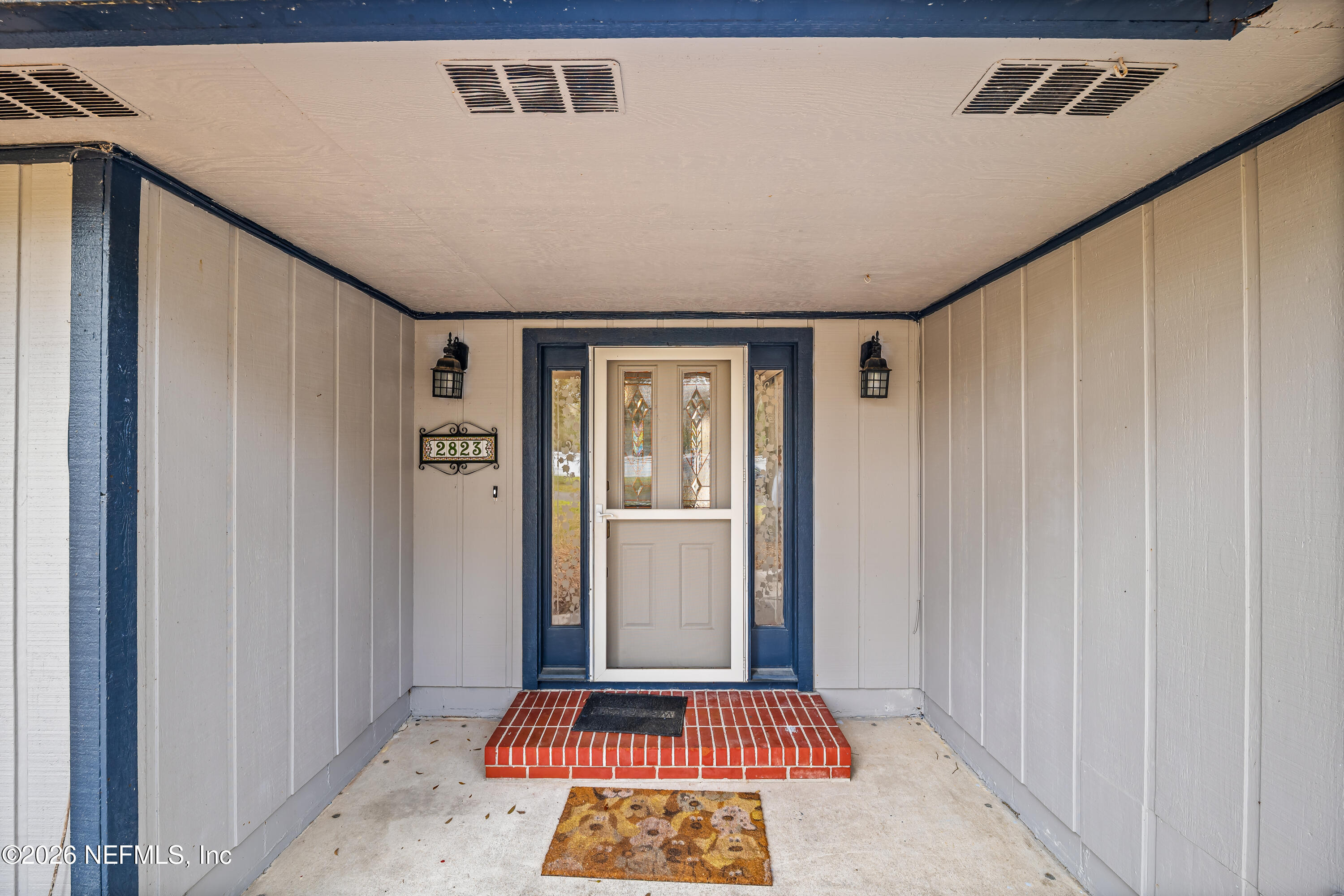 2823 Jewell Road Jacksonville, FL 32216 - Photo 11 of 59 a view of a hallway with wooden floor and a livingroom