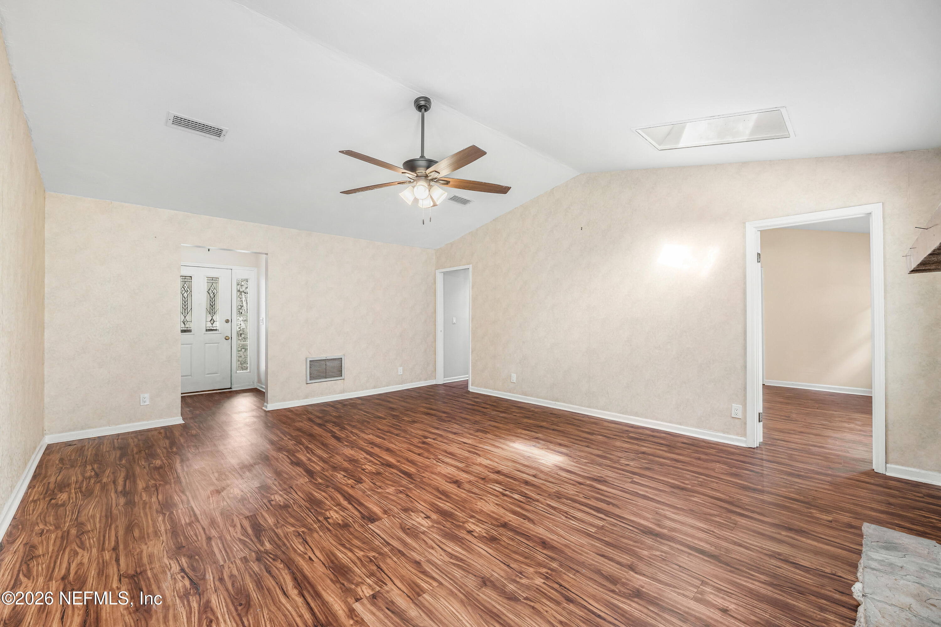 2823 Jewell Road Jacksonville, FL 32216 - Photo 13 of 59 a view of an empty room and wooden floor