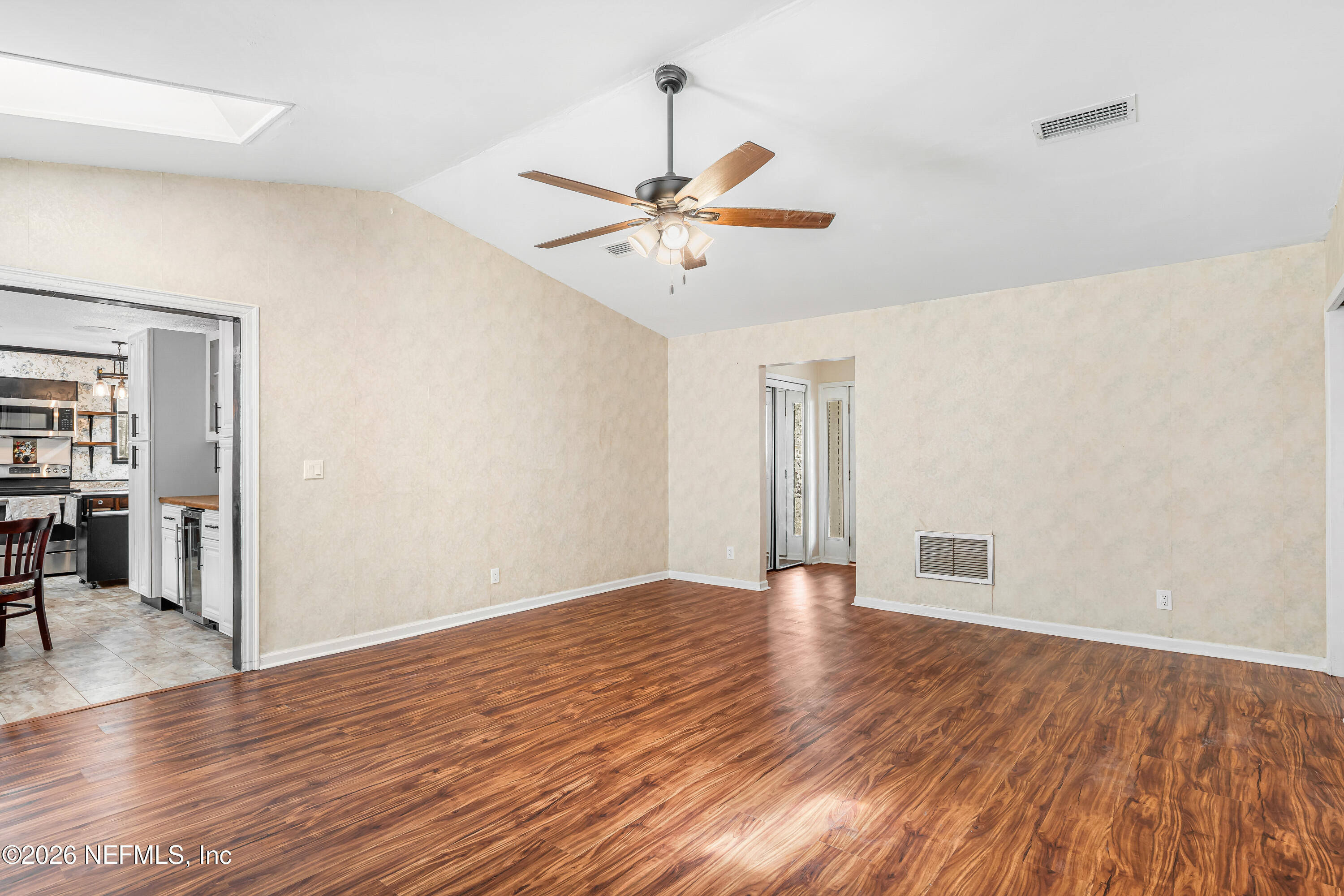 2823 Jewell Road Jacksonville, FL 32216 - Photo 14 of 59 a view of an empty room with wooden floor