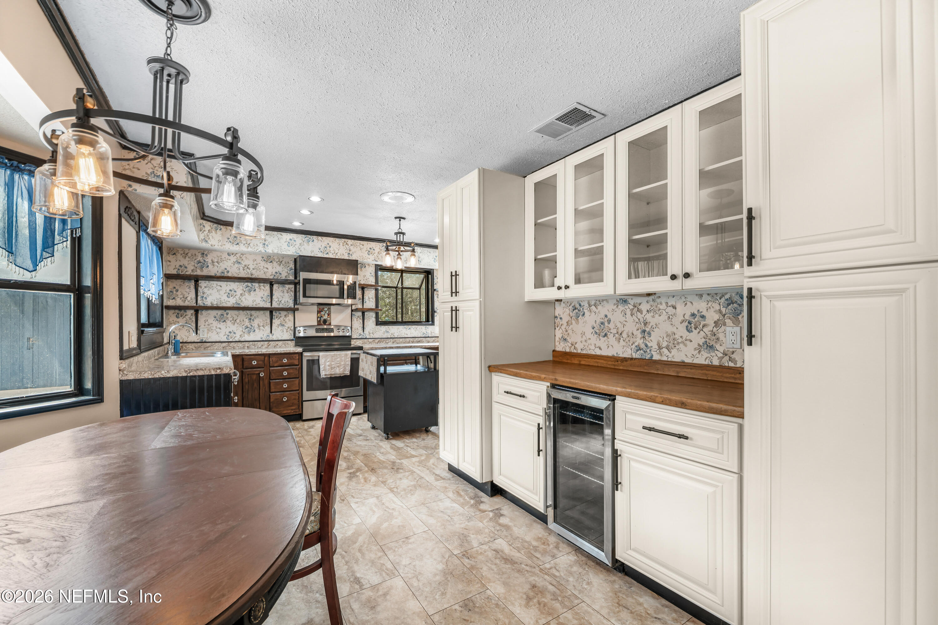2823 Jewell Road Jacksonville, FL 32216 - Photo 15 of 59 a kitchen with stainless steel appliances granite countertop a stove and cabinets