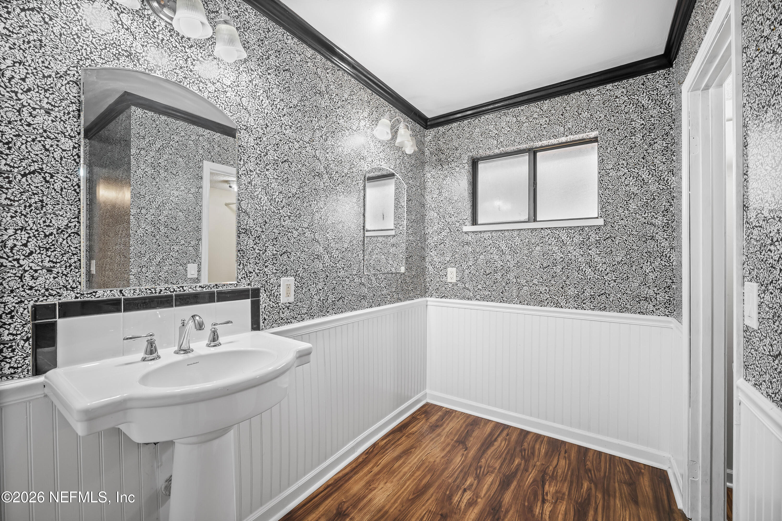 2823 Jewell Road Jacksonville, FL 32216 - Photo 27 of 59 a bathroom with a sink and a bathtub