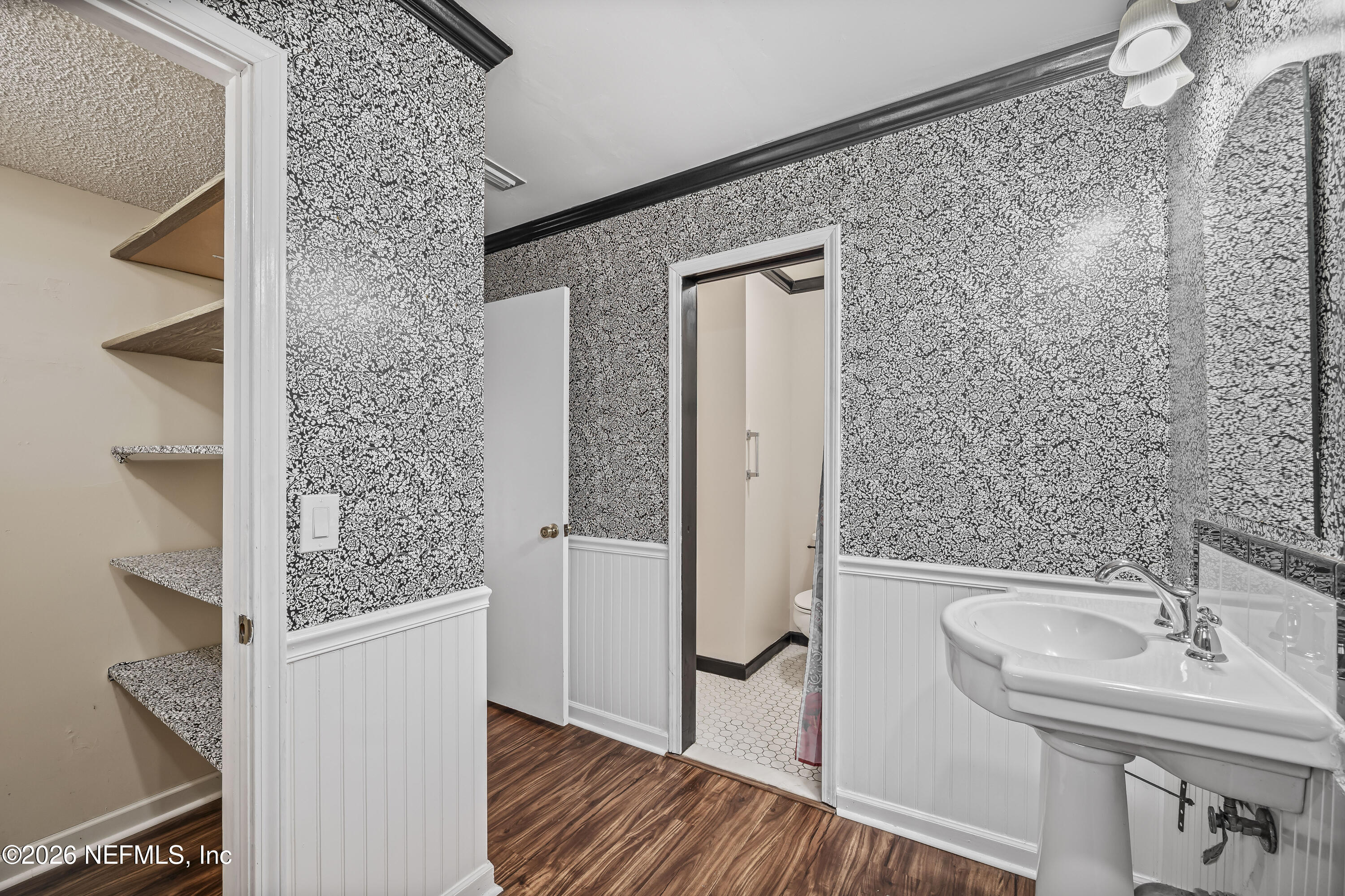 2823 Jewell Road Jacksonville, FL 32216 - Photo 28 of 59 a bathroom with a sink and mirror