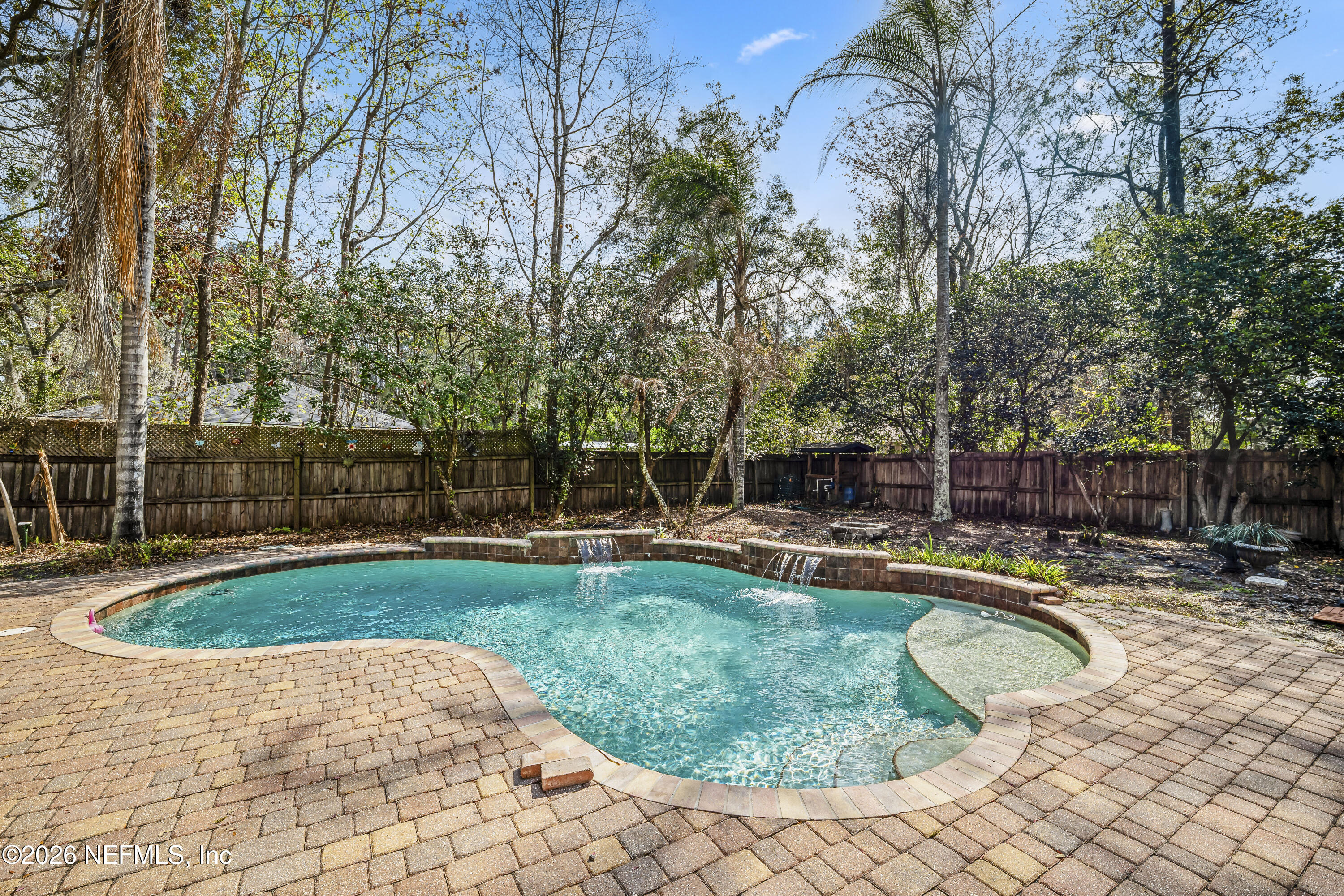 2823 Jewell Road Jacksonville, FL 32216 - Photo 3 of 59 a swimming pool with outdoor seating and yard