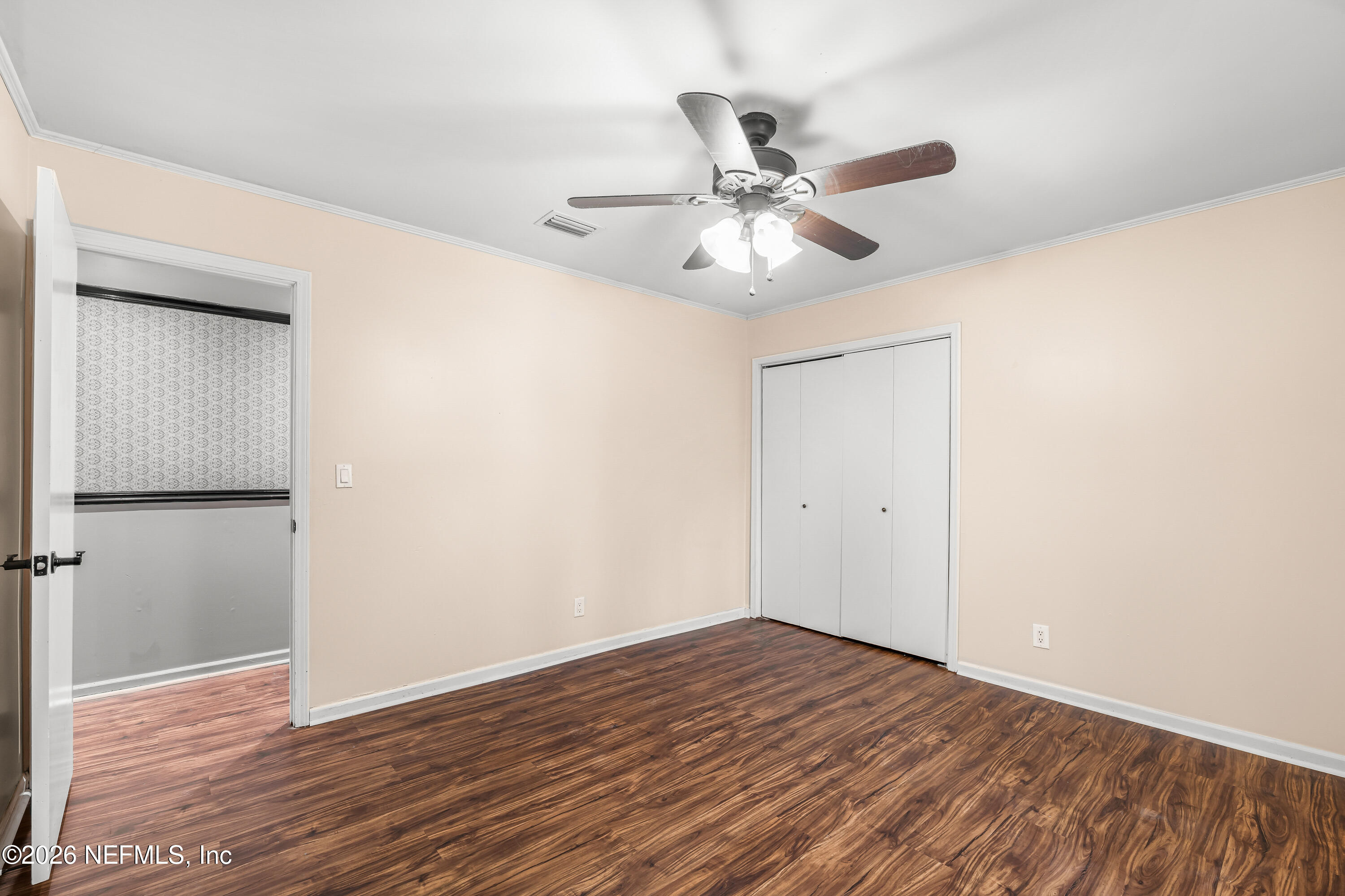 2823 Jewell Road Jacksonville, FL 32216 - Photo 31 of 59 a view of an empty room with wooden floor