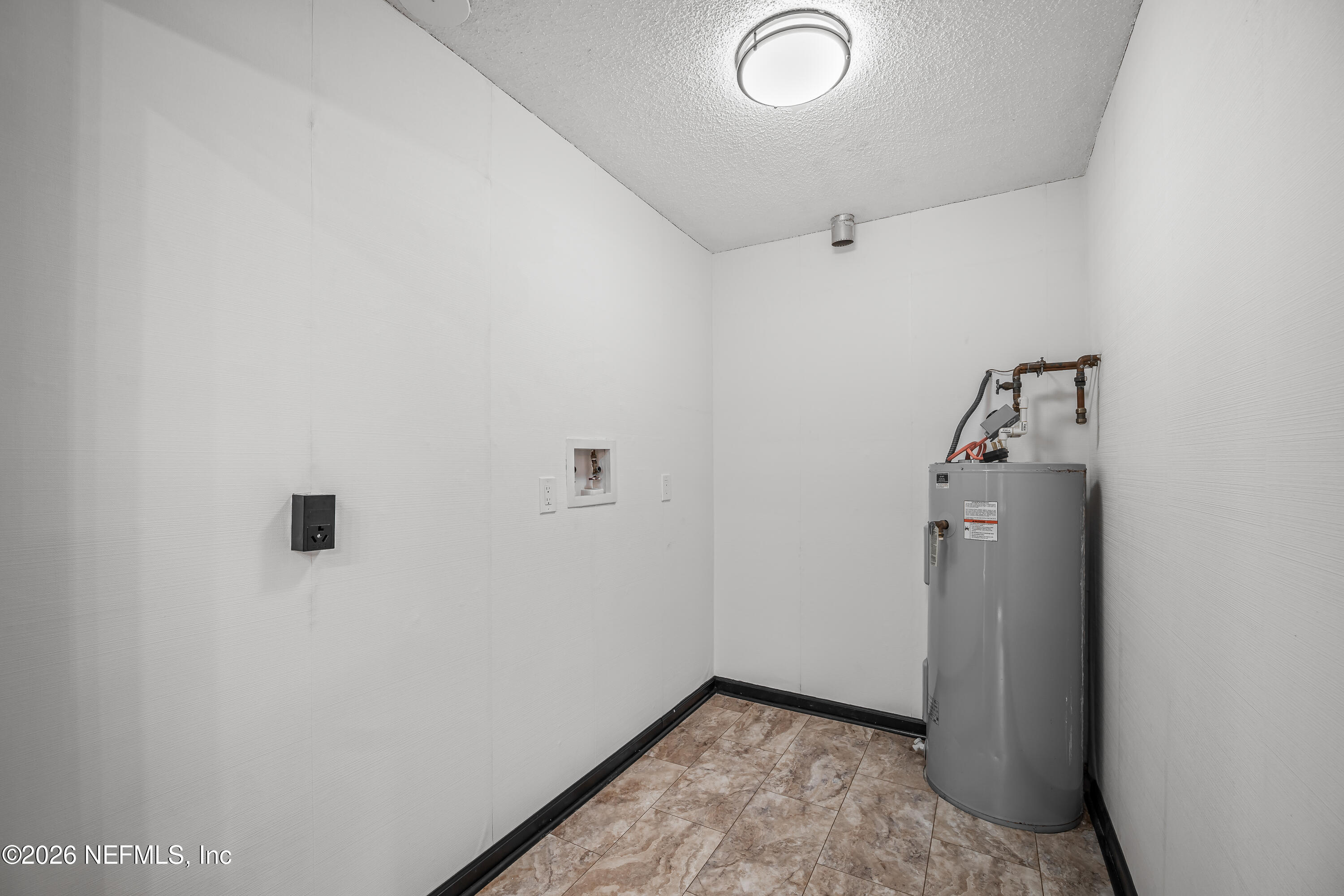 2823 Jewell Road Jacksonville, FL 32216 - Photo 35 of 59 a view of a storage & utility room with a washer dryer