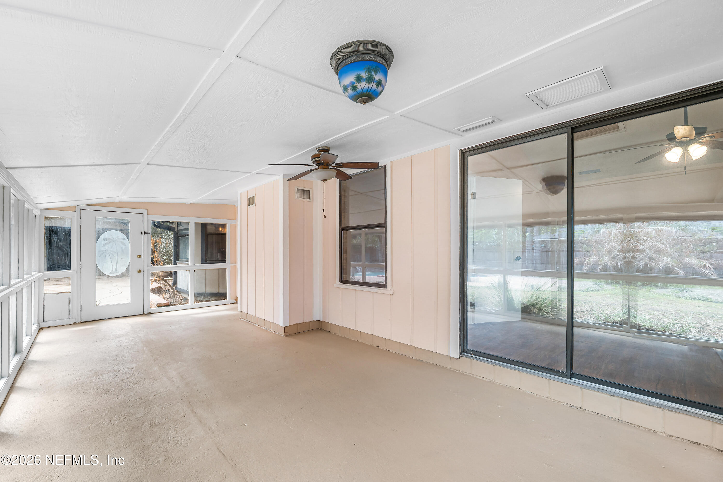 2823 Jewell Road Jacksonville, FL 32216 - Photo 37 of 59 a view of a livingroom with glass door and furniture