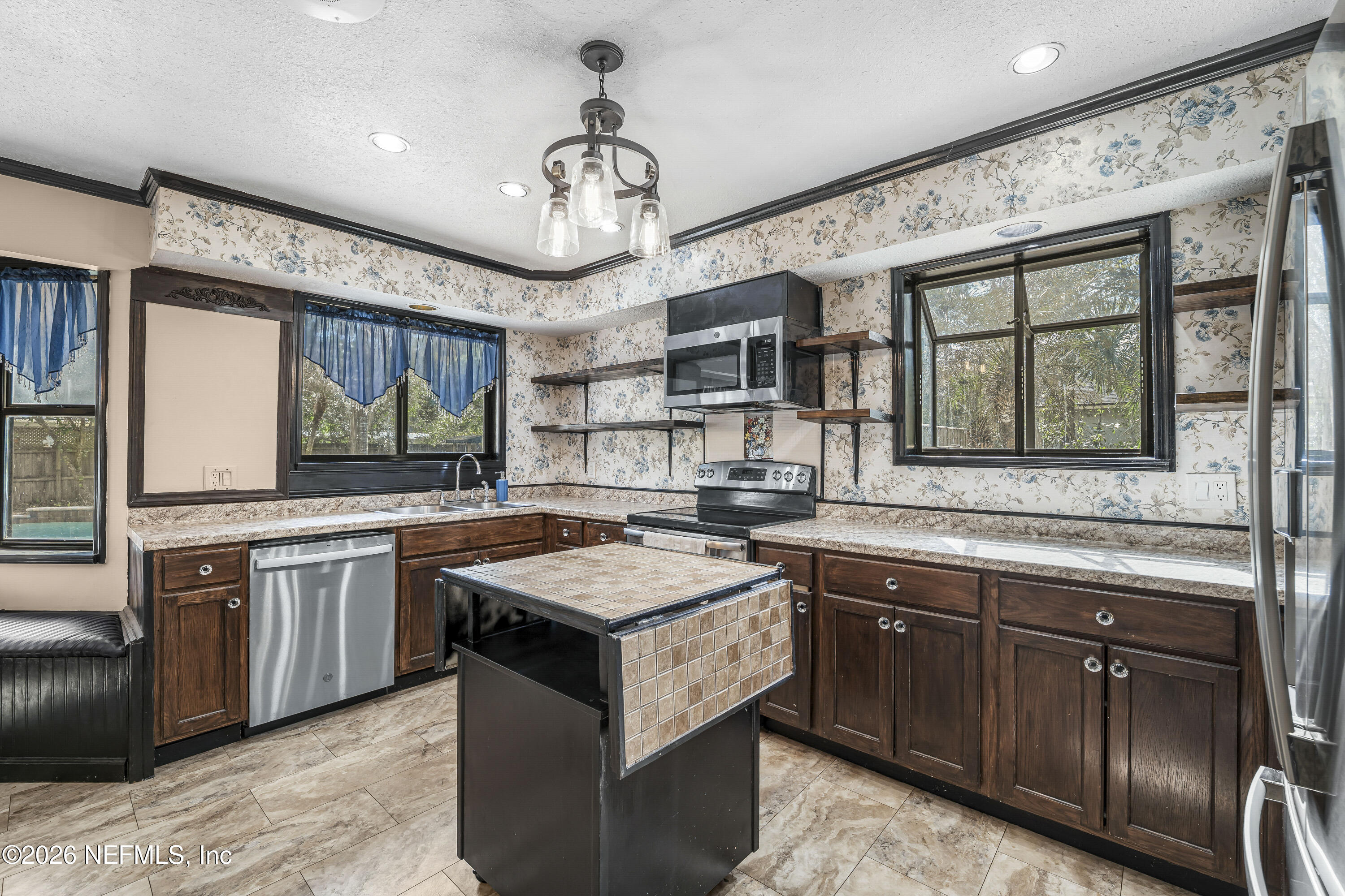 2823 Jewell Road Jacksonville, FL 32216 - Photo 4 of 59 a kitchen with stainless steel appliances granite countertop counter space and a sink