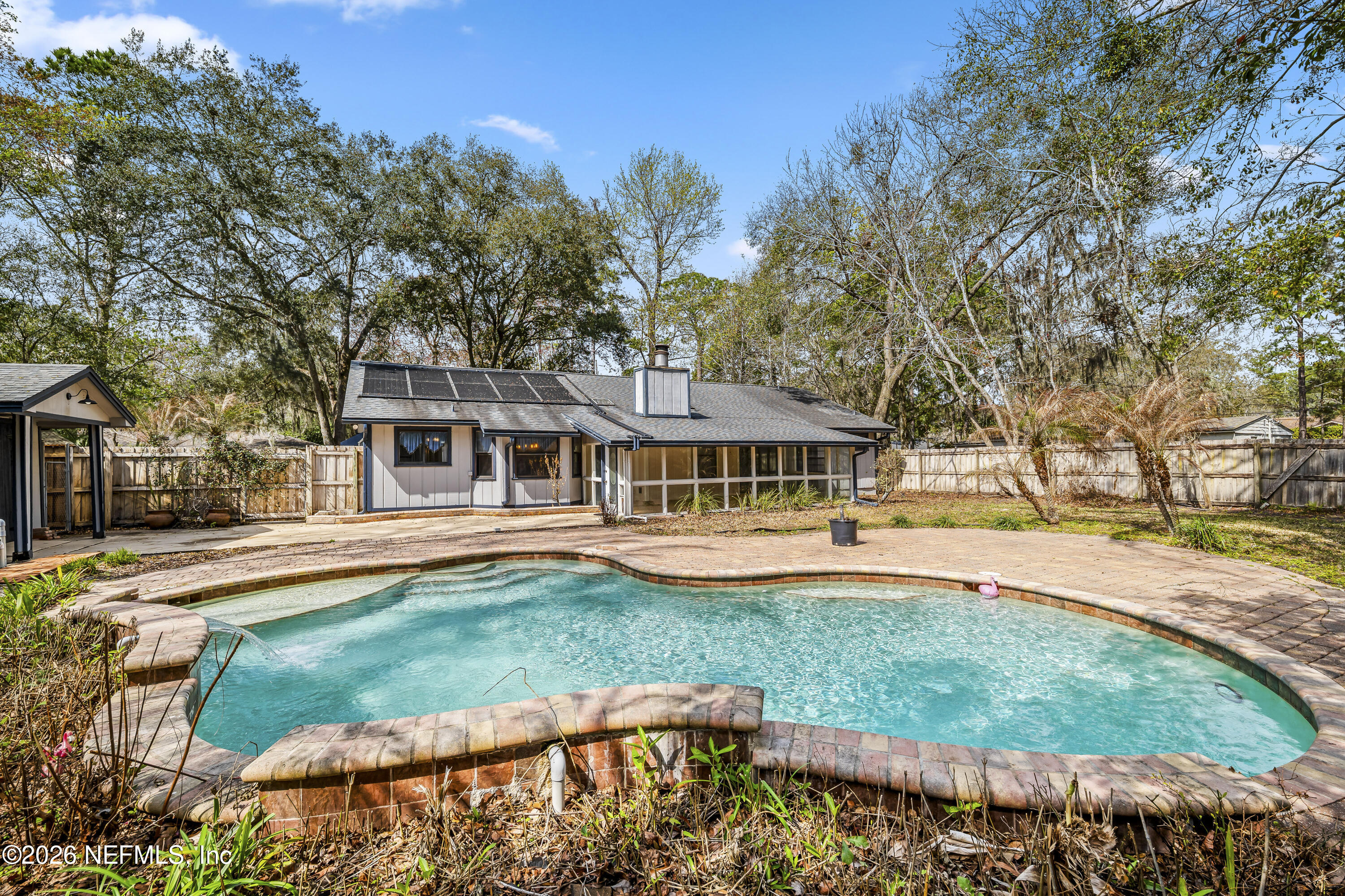 2823 Jewell Road Jacksonville, FL 32216 - Photo 42 of 59 a front view of a house with a yard table and chairs