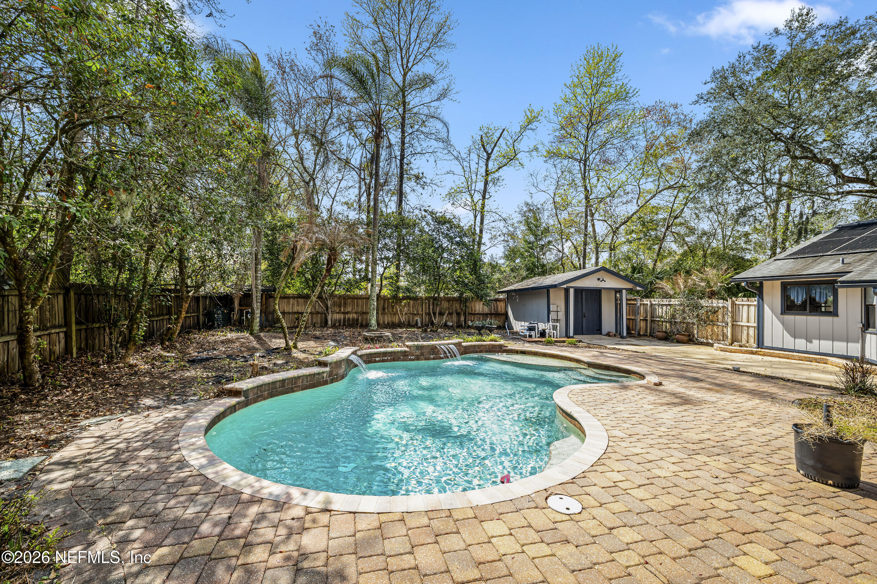 2823 Jewell Road Jacksonville, FL 32216 - Photo 43 of 59 a view of a swimming pool with a patio