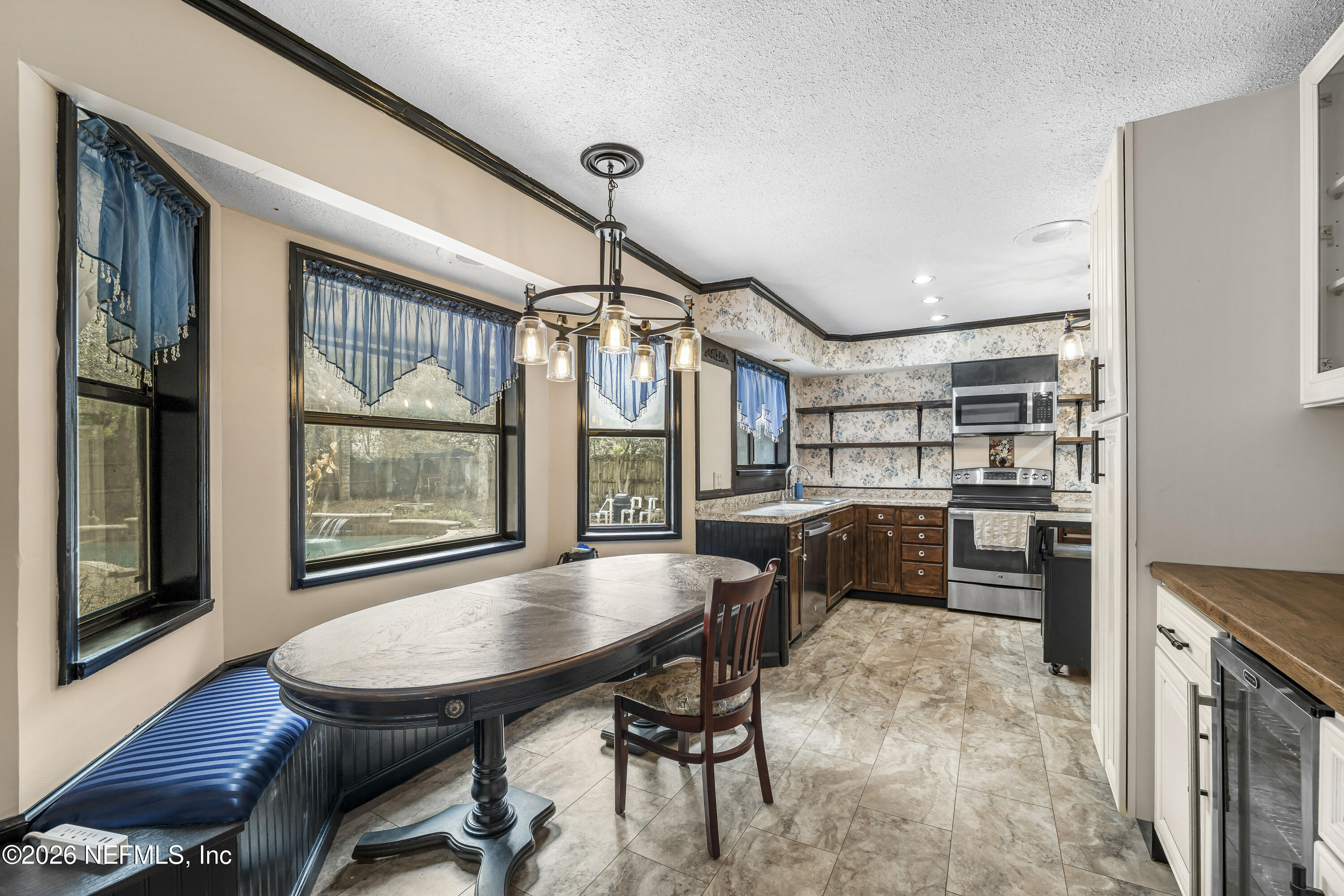 2823 Jewell Road Jacksonville, FL 32216 - Photo 5 of 59 a dining room with furniture and window