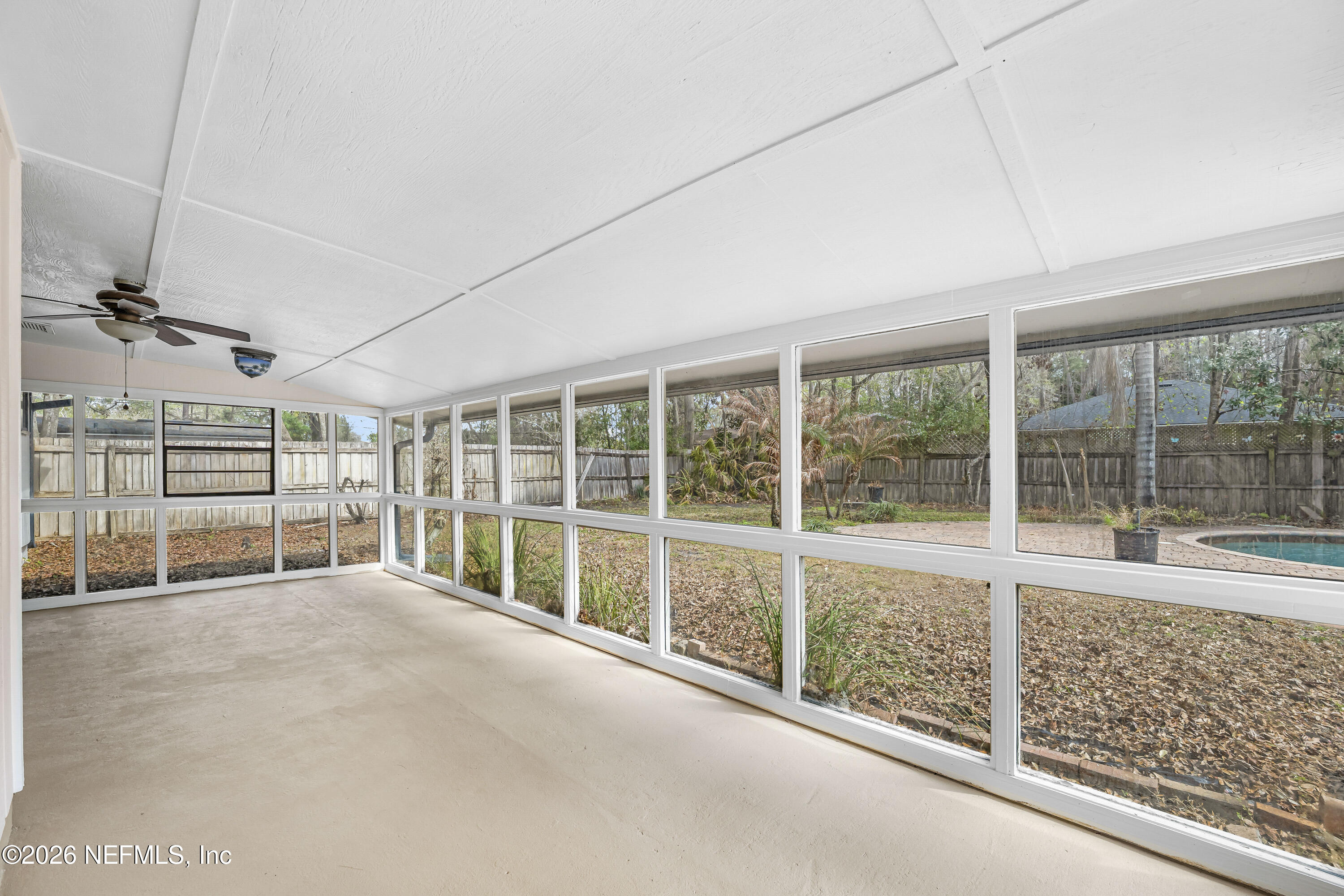 2823 Jewell Road Jacksonville, FL 32216 - Photo 8 of 59 a view of an empty room with a large window