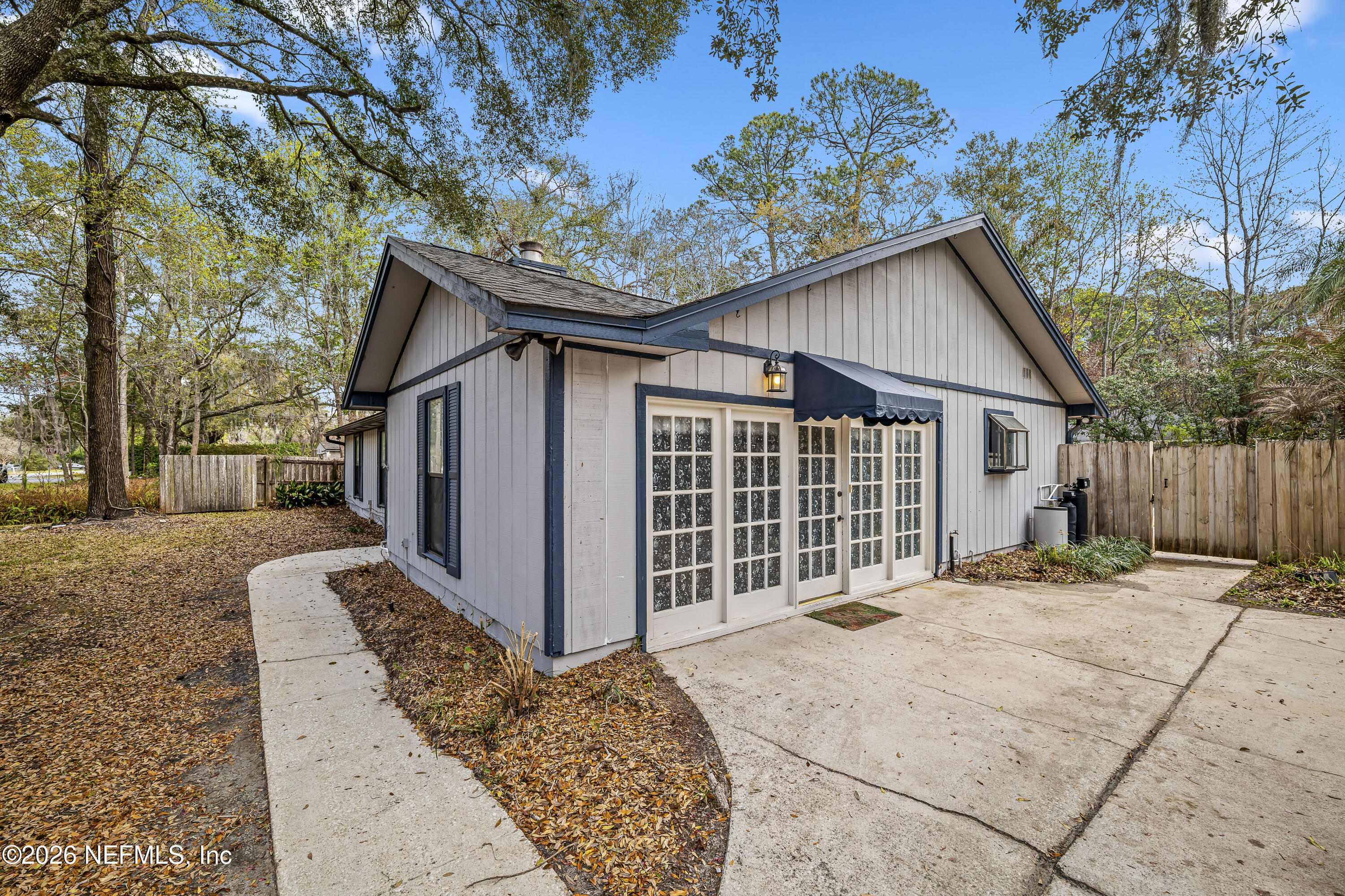 2823 Jewell Road Jacksonville, FL 32216 - Photo 10 of 59 a front view of a house with a garden and yard
