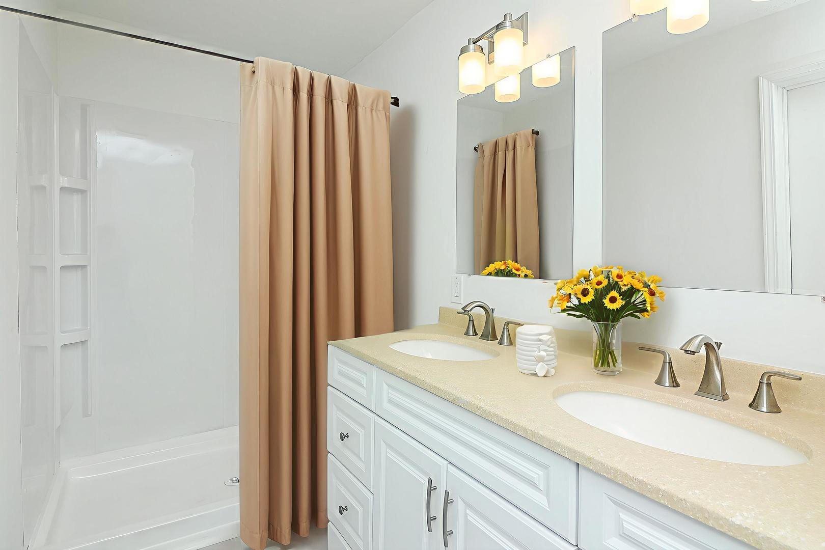 513 Conant Avenue Joliet, IL 60435 - Photo 17 of 30 a bathroom with a double vanity sink and a mirror