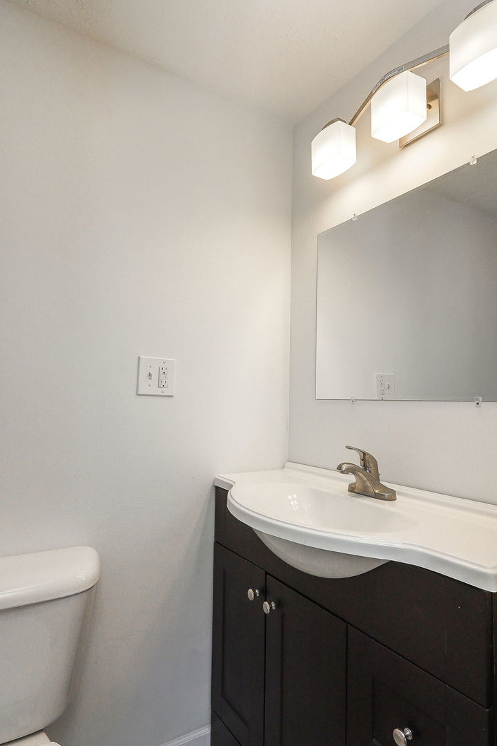513 Conant Avenue Joliet, IL 60435 - Photo 21 of 30 a bathroom with a sink and a mirror