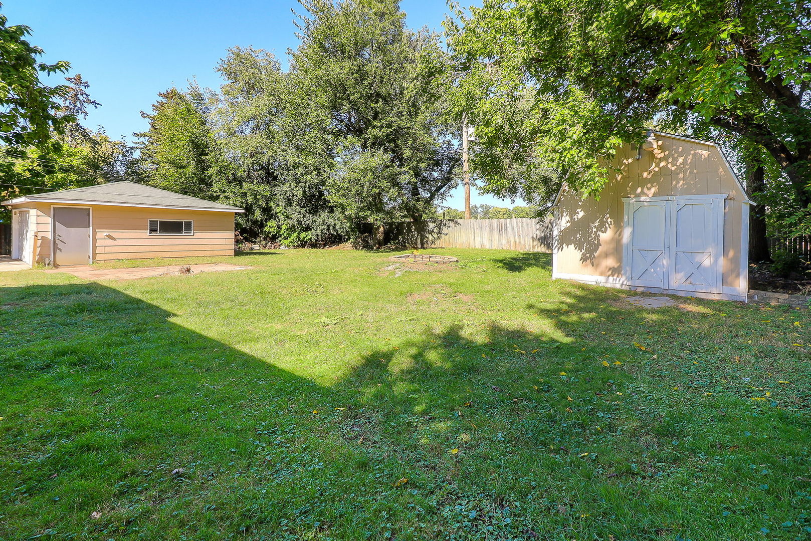 513 Conant Avenue Joliet, IL 60435 - Photo 24 of 30 a front view of a house with yard and trees