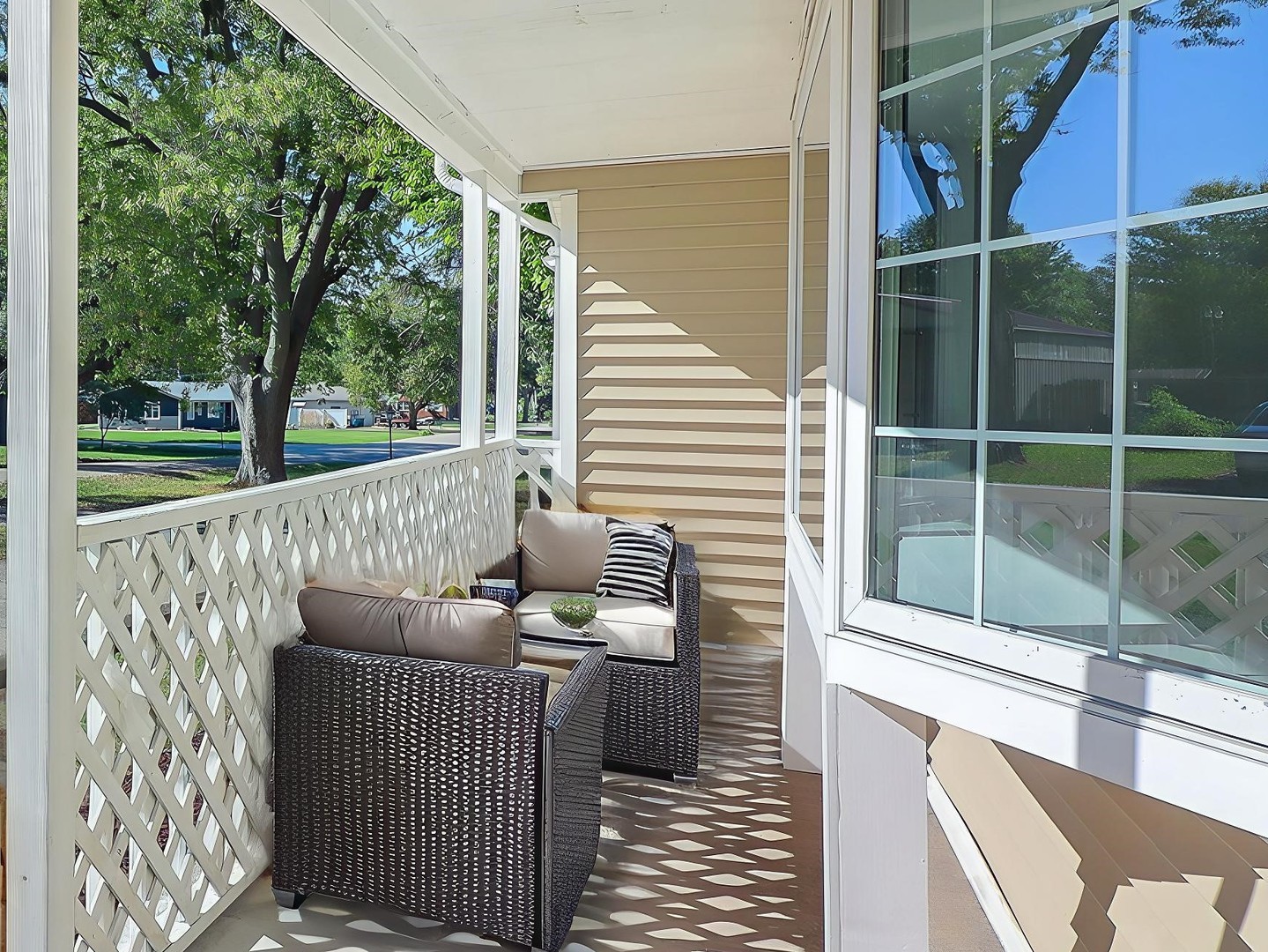 513 Conant Avenue Joliet, IL 60435 - Photo 4 of 30 a view of a deck with couches with wooden floor and fence