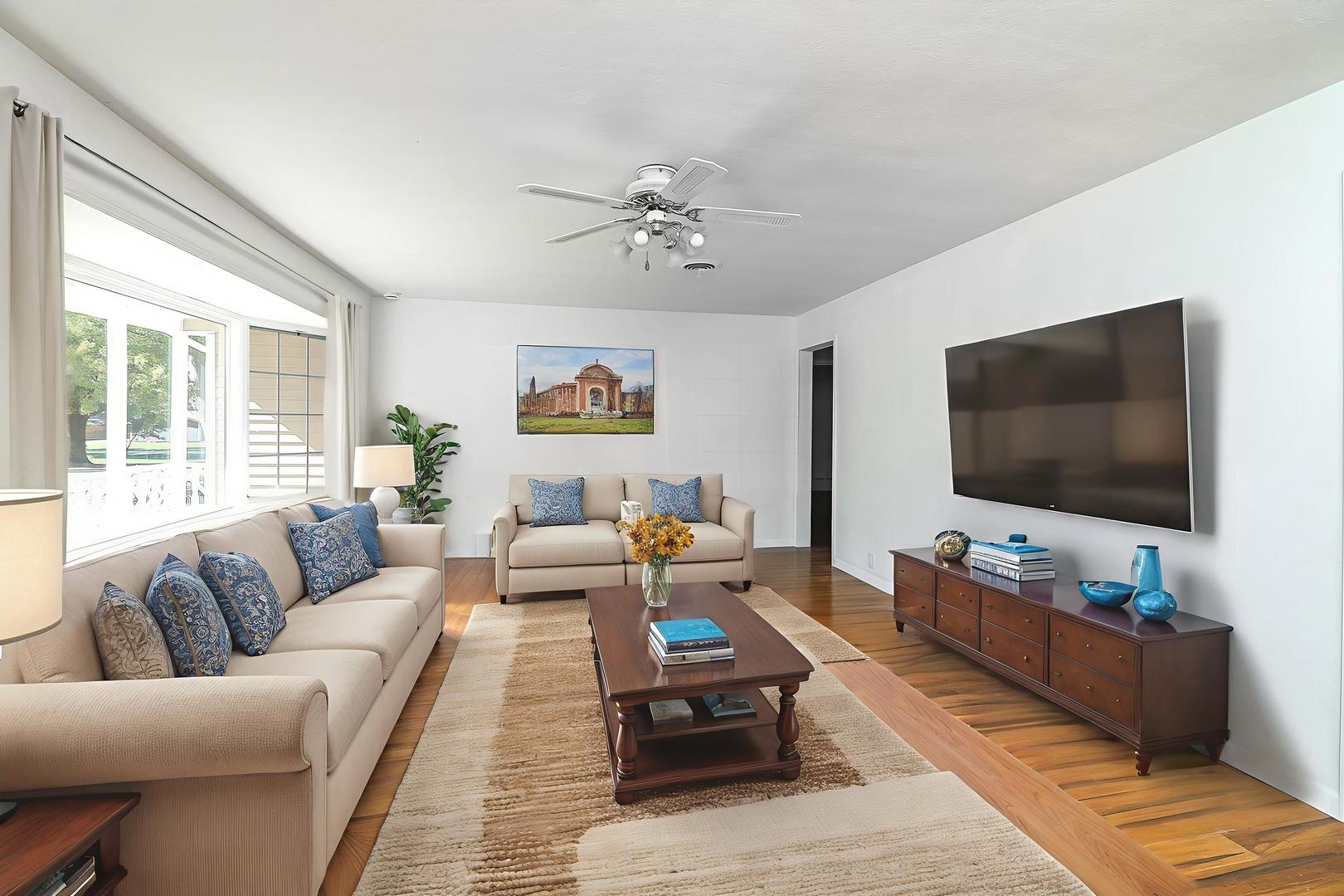 513 Conant Avenue Joliet, IL 60435 - Photo 6 of 30 a living room with furniture and a flat screen tv