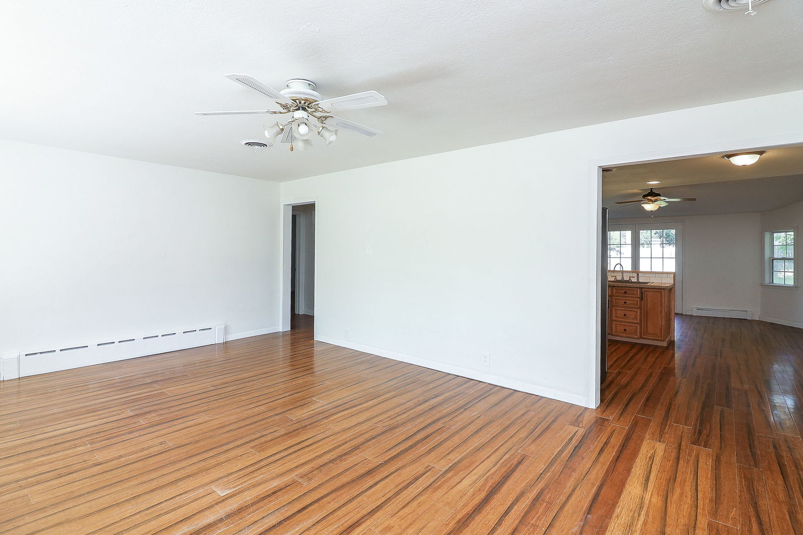 513 Conant Avenue Joliet, IL 60435 - Photo 7 of 30 wooden floor in an empty room with a window