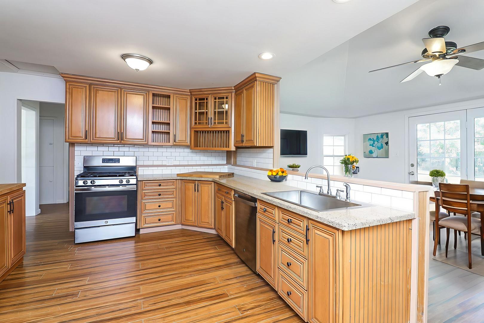 513 Conant Avenue Joliet, IL 60435 - Photo 8 of 30 a kitchen with stainless steel appliances granite countertop a sink stove and refrigerator