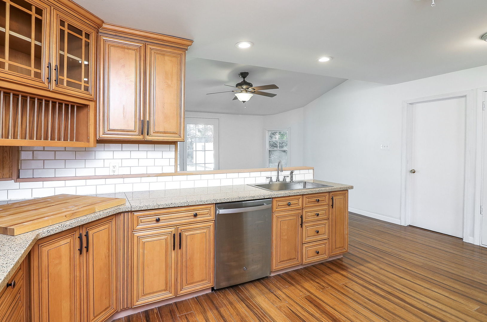 513 Conant Avenue Joliet, IL 60435 - Photo 9 of 30 a kitchen with stainless steel appliances granite countertop a sink cabinets and wooden floor