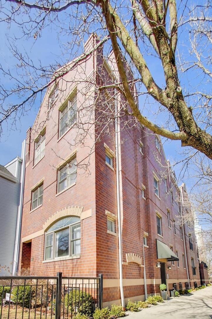 1400 West George Street, Unit 3 Chicago, IL 60657 - Photo 1 of 46 a front view of a multi story building