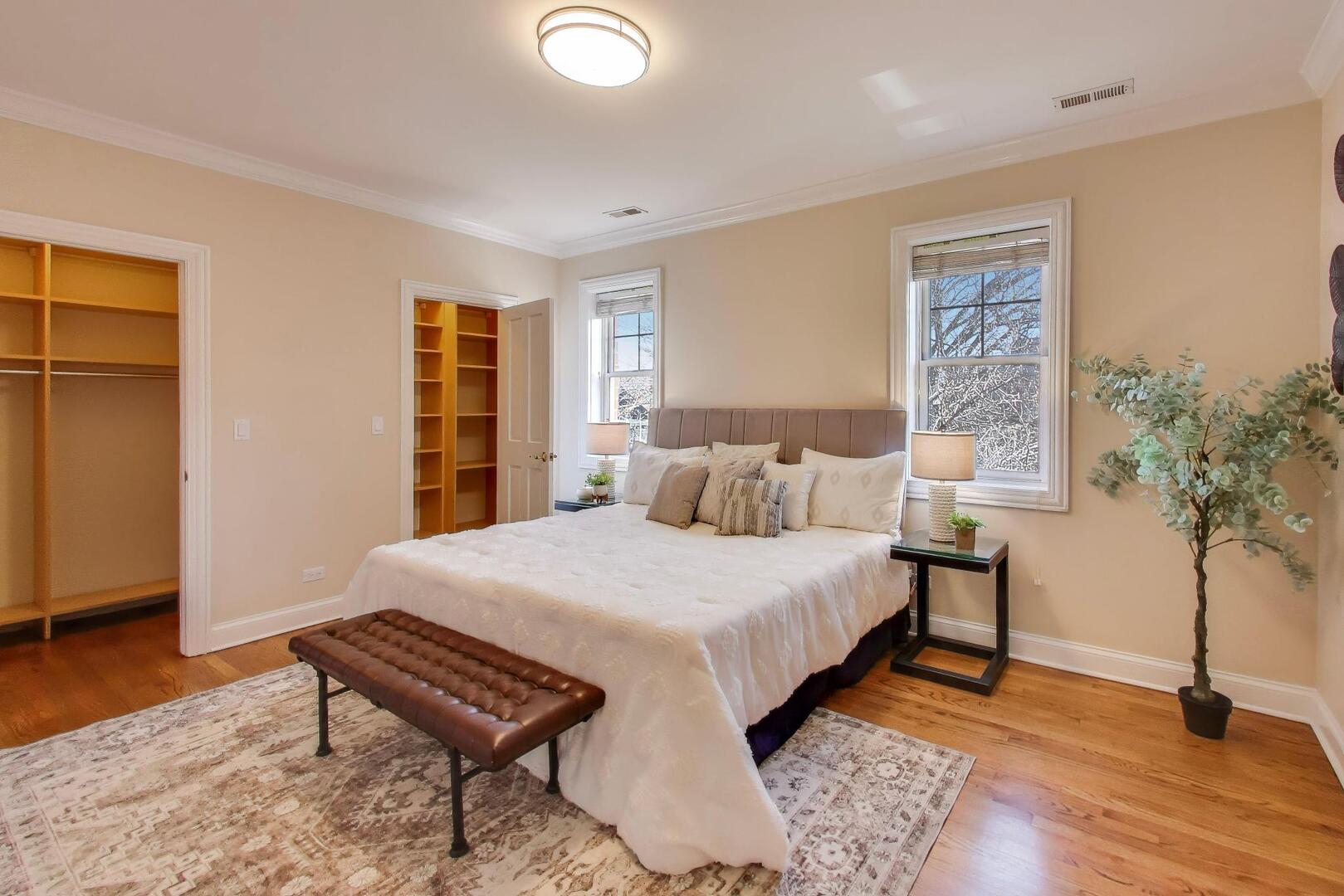 1400 West George Street, Unit 3 Chicago, IL 60657 - Photo 14 of 46 a bedroom with a bed and a potted plant