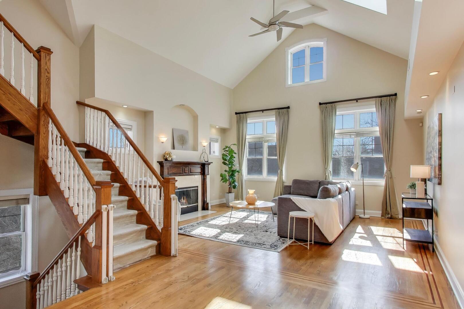 1400 West George Street, Unit 3 Chicago, IL 60657 - Photo 2 of 46 a living room with furniture or stairs and a wooden floor