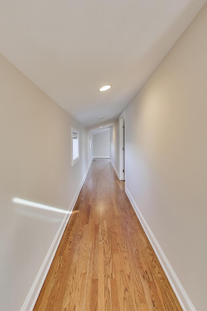 1400 West George Street, Unit 3 Chicago, IL 60657 - Photo 29 of 46 a view of a big room with wooden floor and stairs