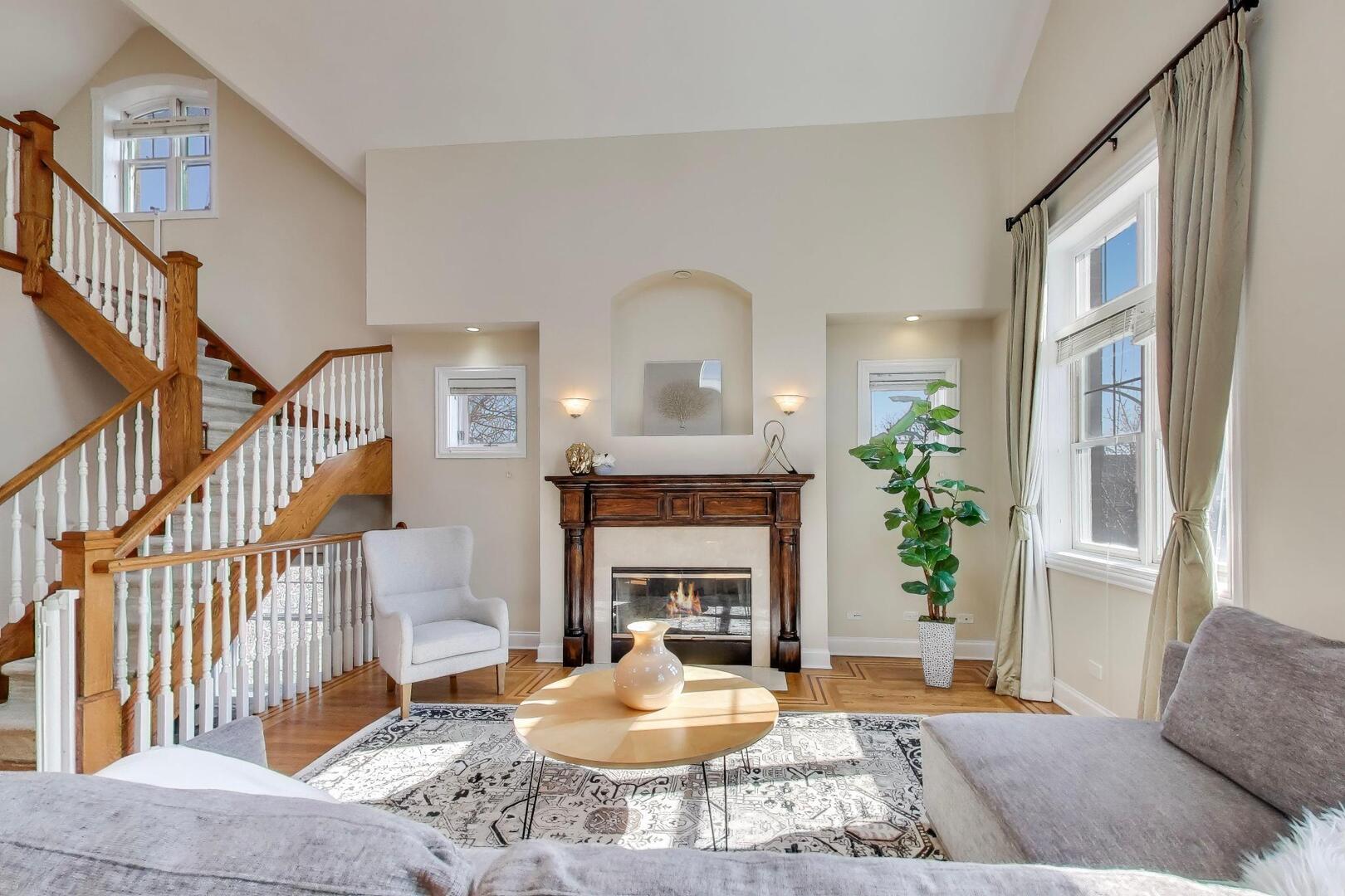1400 West George Street, Unit 3 Chicago, IL 60657 - Photo 3 of 46 a living room with furniture and a fireplace
