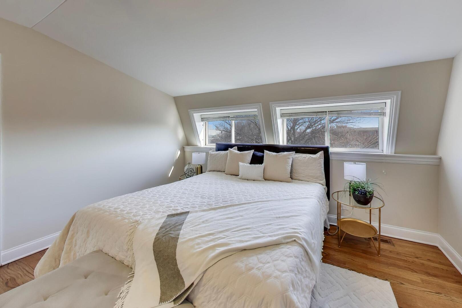 1400 West George Street, Unit 3 Chicago, IL 60657 - Photo 31 of 46 a bedroom with a bed and wooden floor