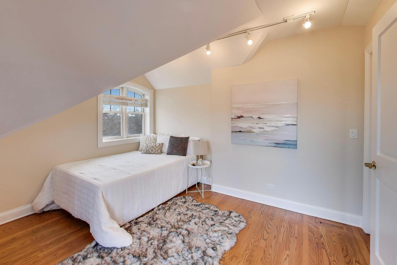 1400 West George Street, Unit 3 Chicago, IL 60657 - Photo 38 of 46 a bedroom with a bed and a window