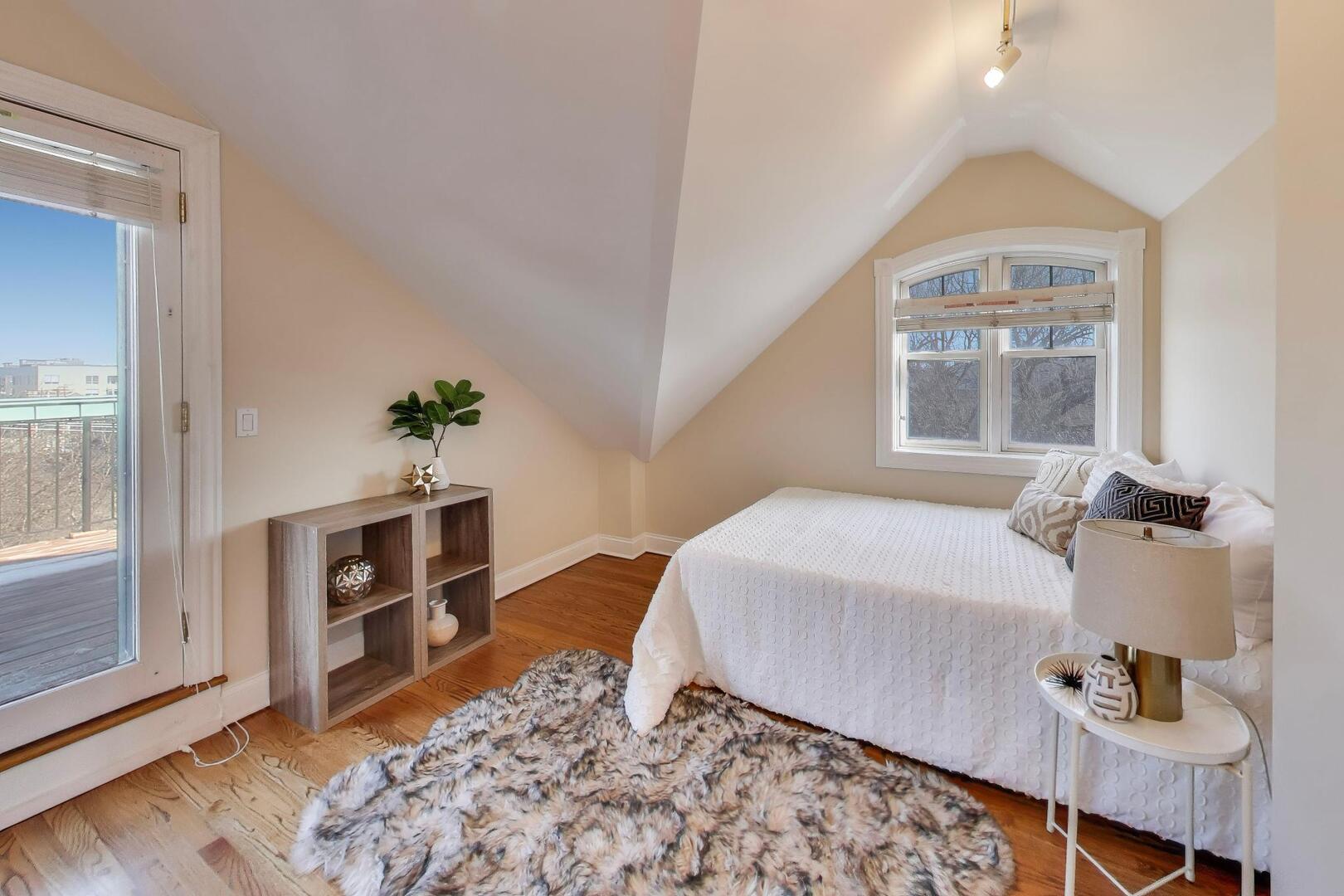 1400 West George Street, Unit 3 Chicago, IL 60657 - Photo 39 of 46 a bedroom with a bed and a dresser with wooden floor