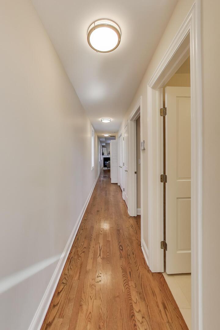 1400 West George Street, Unit 3 Chicago, IL 60657 - Photo 40 of 46 a view of a hallway with wooden floor and staircase