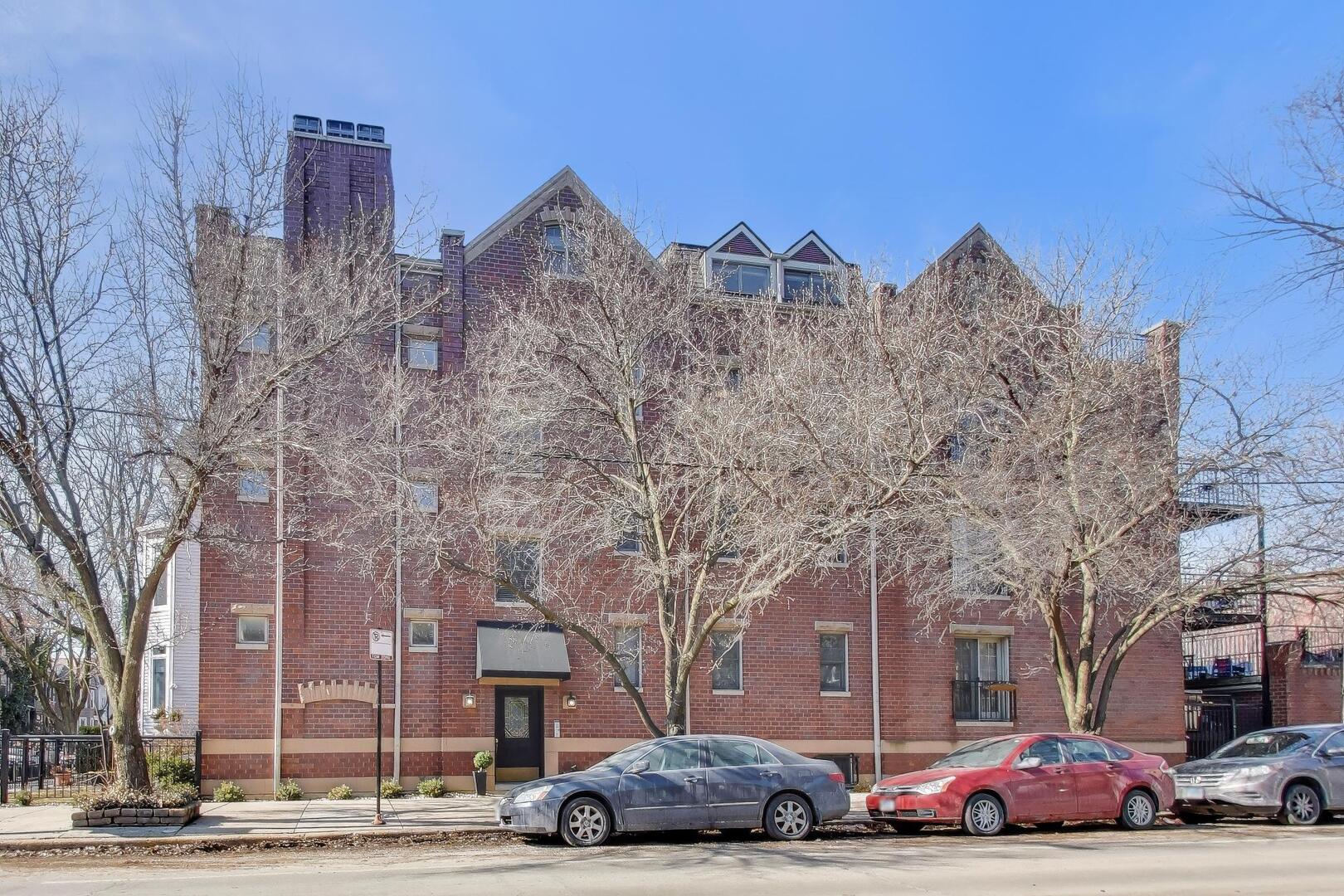 1400 West George Street, Unit 3 Chicago, IL 60657 - Photo 44 of 46 a view of a cars parked in front of a building