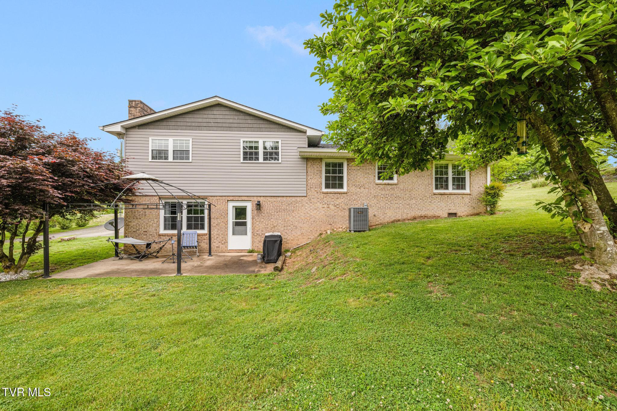 780 Dry Branch Road Bluff City, TN 37618 - Photo 25 of 32 Back view of home
