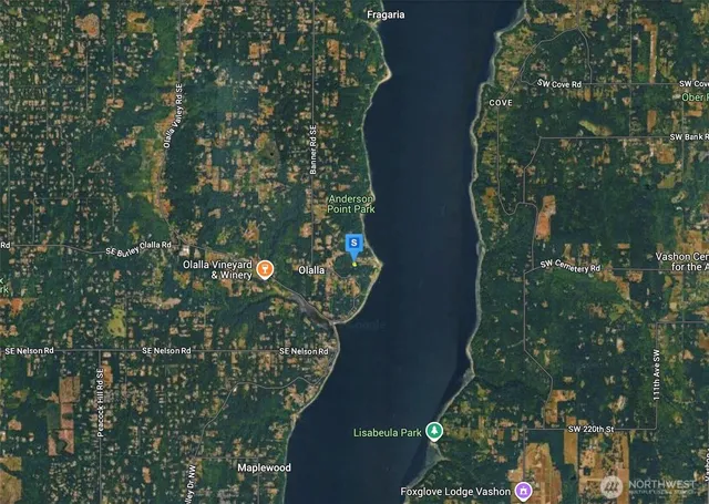 an aerial view of a residential houses with outdoor space