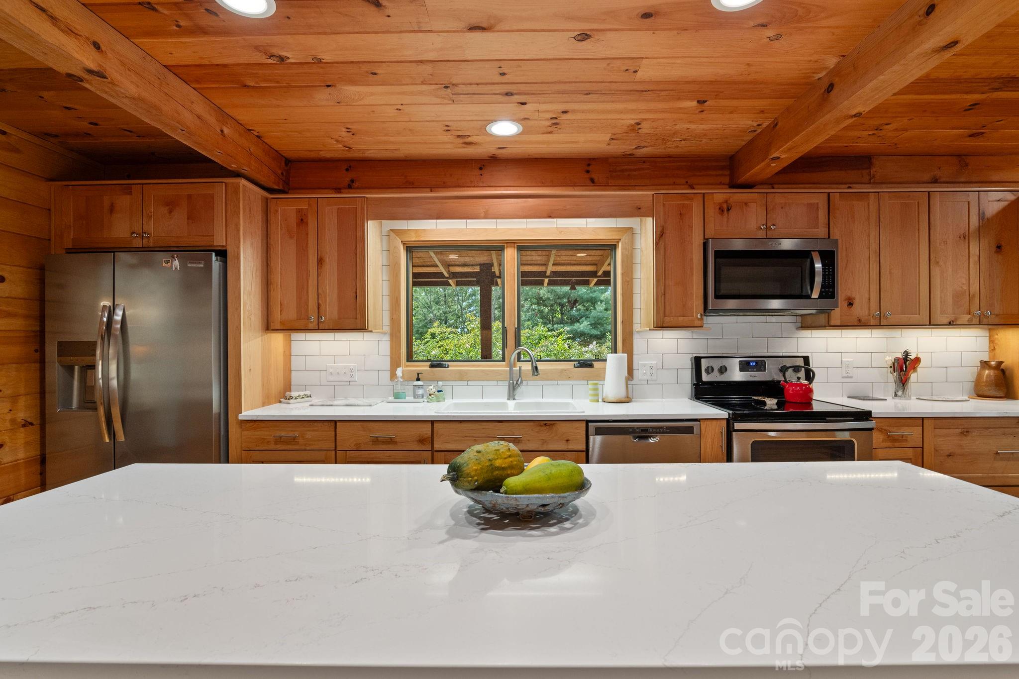 150 Avondale Ridge Road Asheville, NC 28803 - Photo 12 of 45 a kitchen with stainless steel appliances granite countertop a refrigerator and a stove top oven