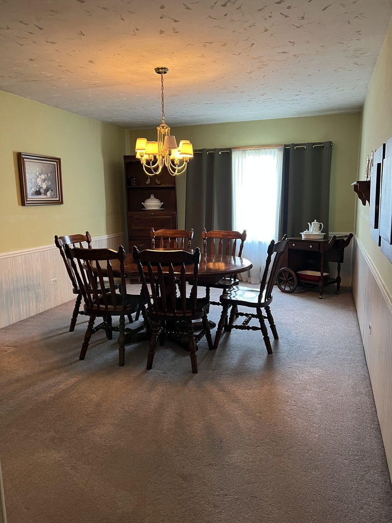11006 Princess Avenue Chicago Ridge, IL 60415 - Photo 7 of 16 a view of a dining room with furniture and chandelier