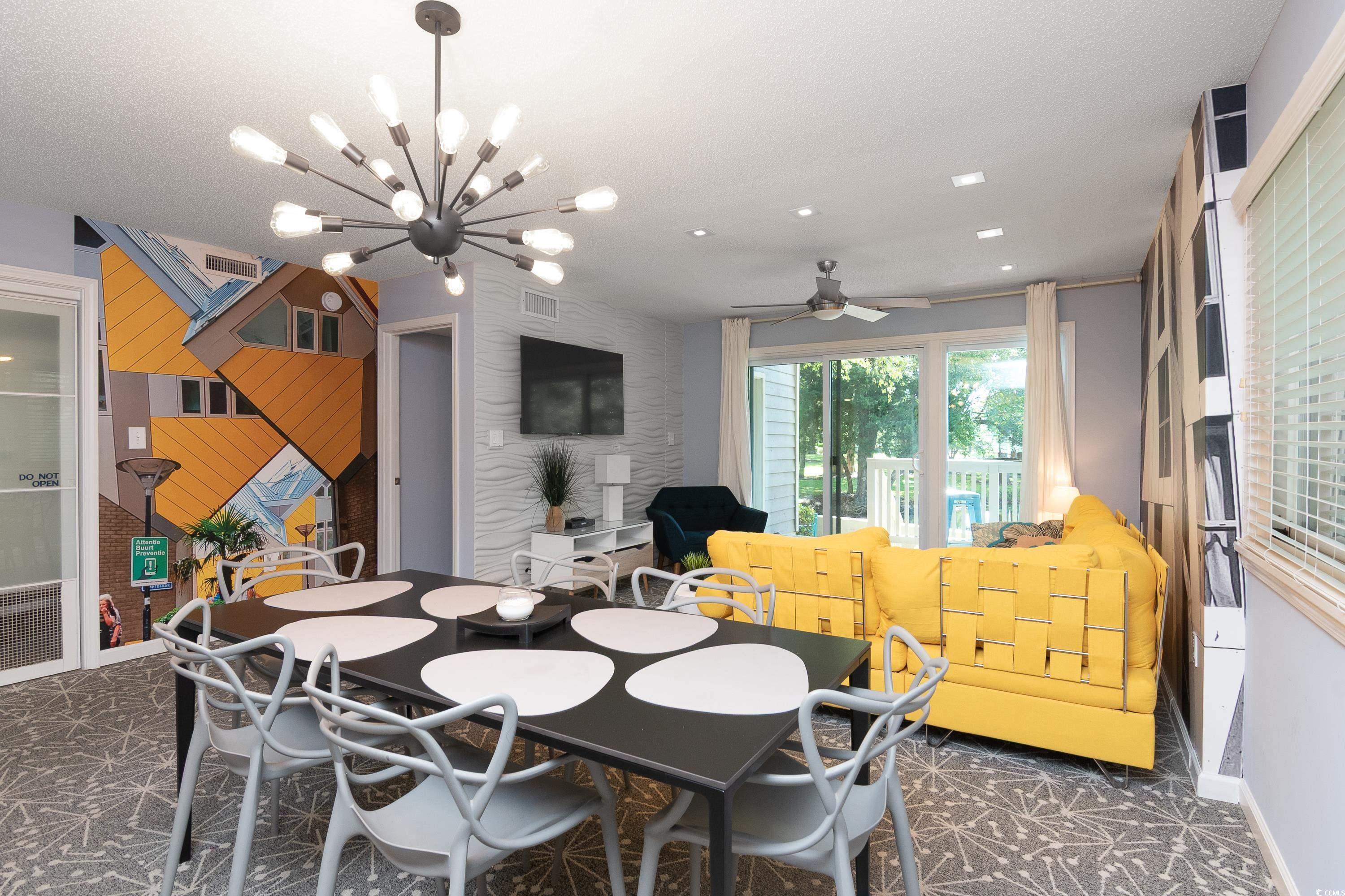 211 Baslow Court, Unit 2C Myrtle Beach, SC 29572 - Photo 11 of 33 Dining space featuring a chandelier and ceiling fan