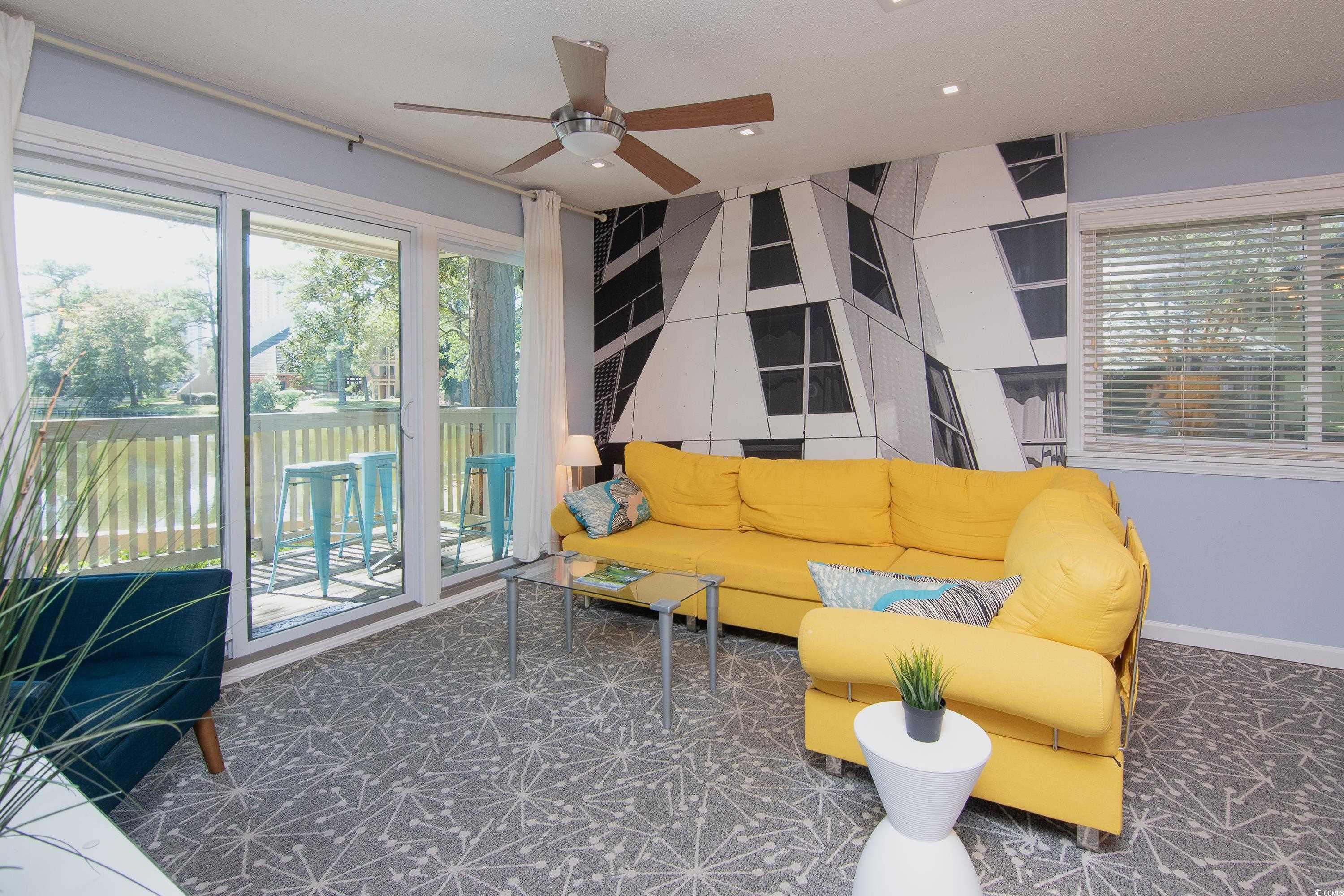211 Baslow Court, Unit 2C Myrtle Beach, SC 29572 - Photo 13 of 33 Living room featuring ceiling fan and baseboards