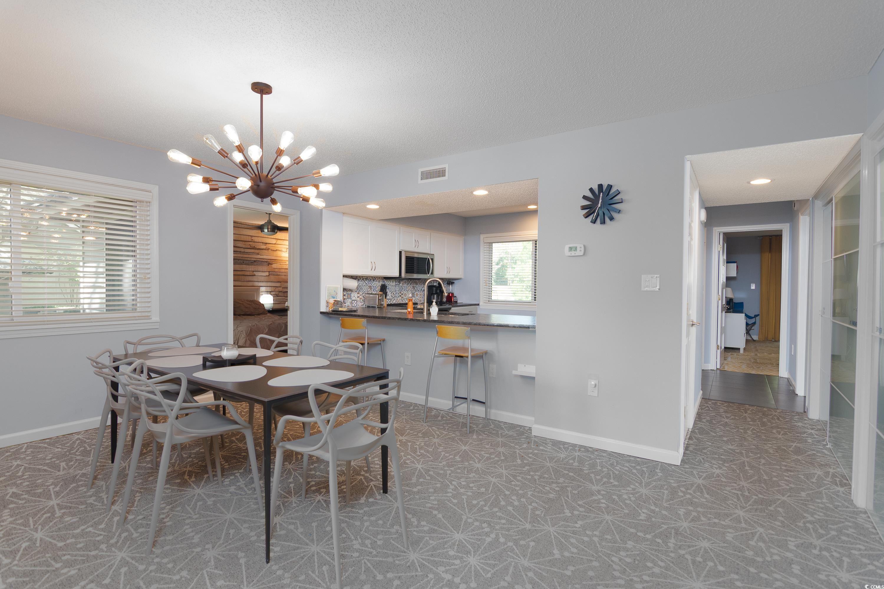 211 Baslow Court, Unit 2C Myrtle Beach, SC 29572 - Photo 24 of 33 Dining area with a chandelier and recessed lighting