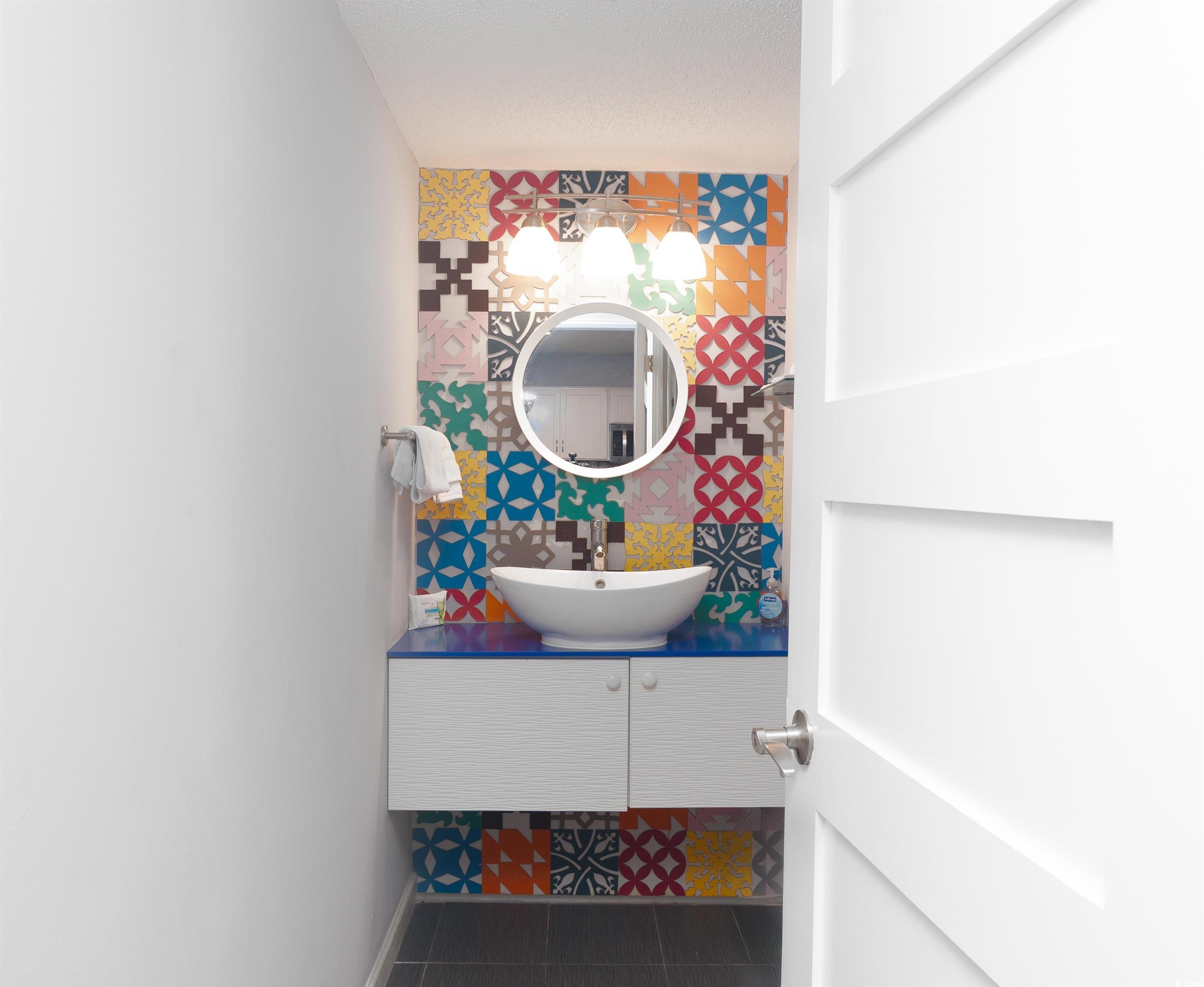 211 Baslow Court, Unit 2C Myrtle Beach, SC 29572 - Photo 5 of 33 Half bathroom with tile patterned floors and vanity